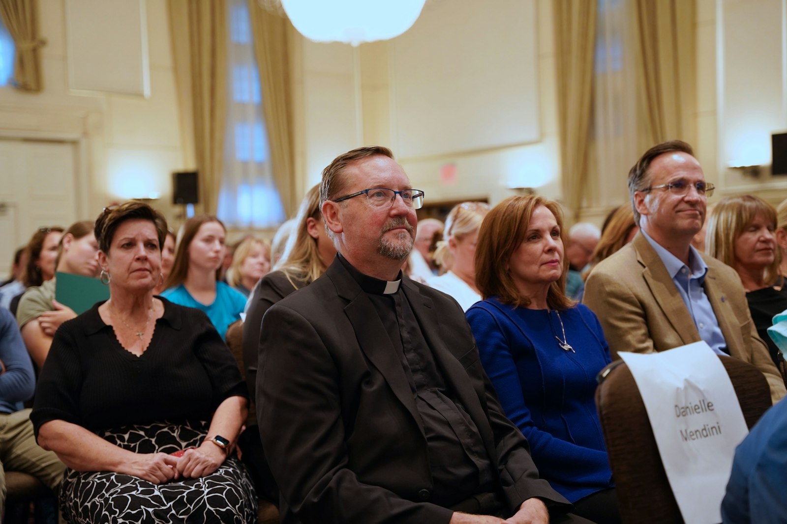 Fr. Joe Horn of St. Andrew Parish in Rochester emceed the event. The talk was originally planned as a "Live at the Basilica" event, where Fr. Horn used to serve as rector at the National Shrine of the Little Flower Basilica in Royal Oak, before the lecture was moved to St. John's as an independent event supported by area sponsors.