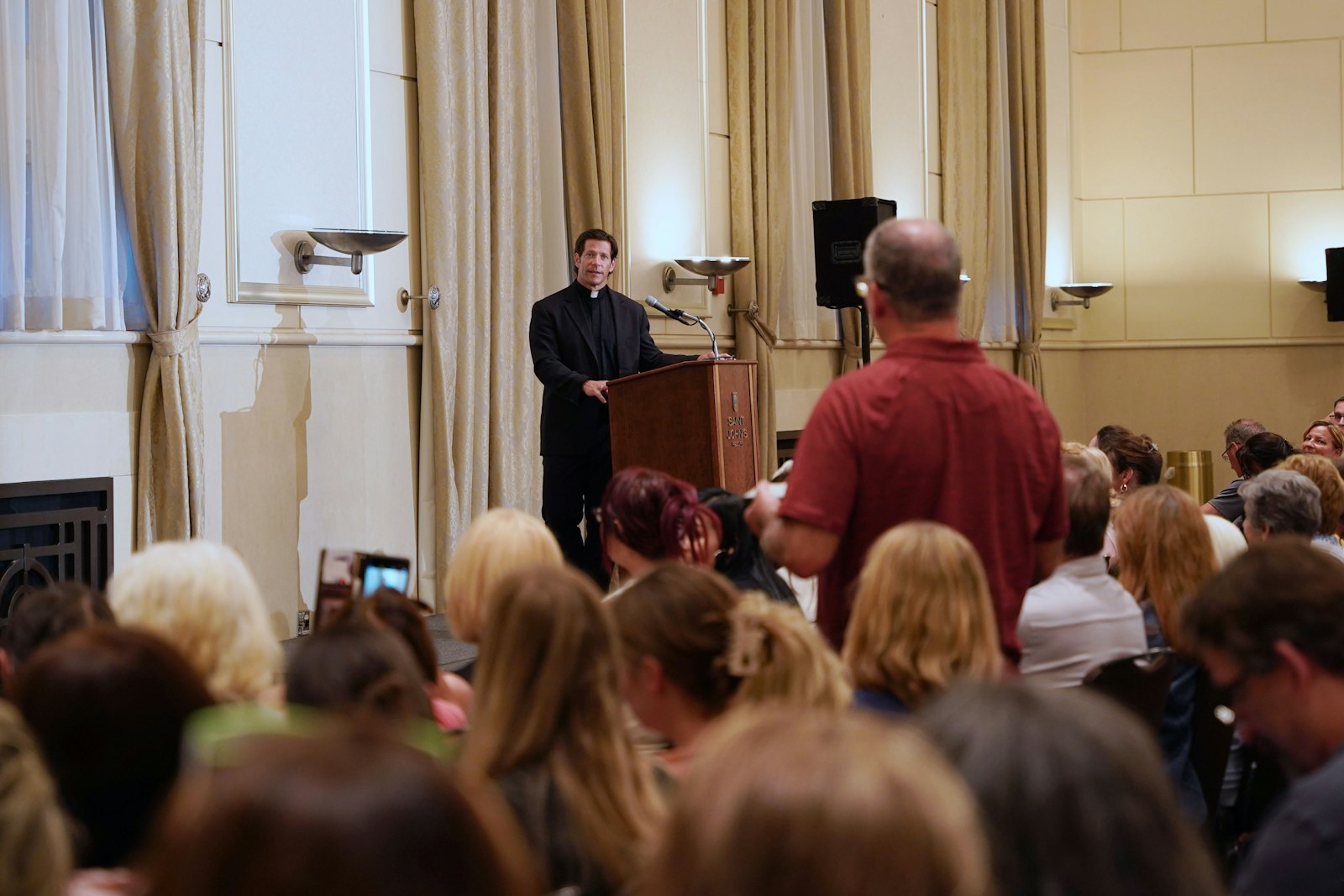 Fr. Schmitz takes a question from an audience member after his talk. The famed podcaster told audience members, to some surprise, that despite his numerous speaking engagements, he's an introvert who enjoys quiet time to himself.