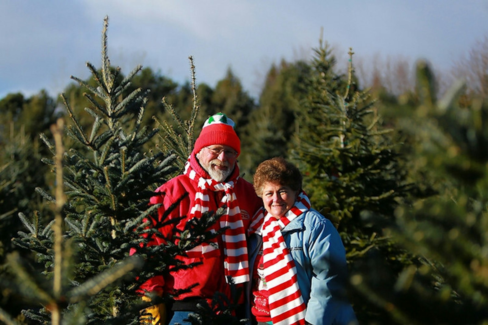 Frank and Catherine Genovese are pictured among the trees on their 16-acre farm in rural Oxford. Frank Genovese, who died in 2019, devotedly worked to make the farm a destination for families and was known for giving hugs to those who came to visit. (Family photo)