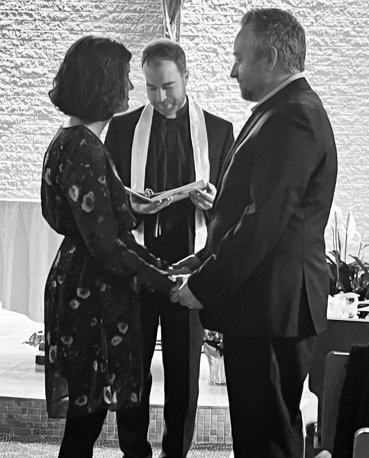 Fr. Grayson Heenan, center, presides over David and Juliet Gardner's vows during a convalidation of their marriage at St. Andrew Parish in Rochester.