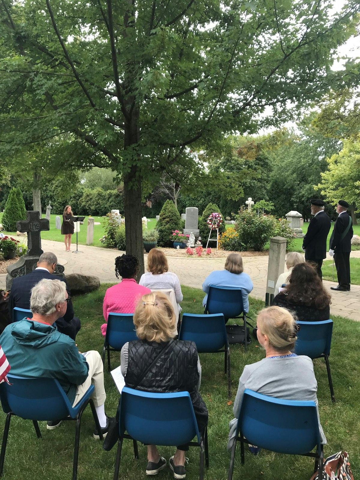 Madeline Thibault sings a hymn during the National Day of Remembrance for Aborted Children memorial service Sept. 9 at Assumption Grotto Cemetery in Detroit. (Kelly Luttinen | Special to Detroit Catholic)