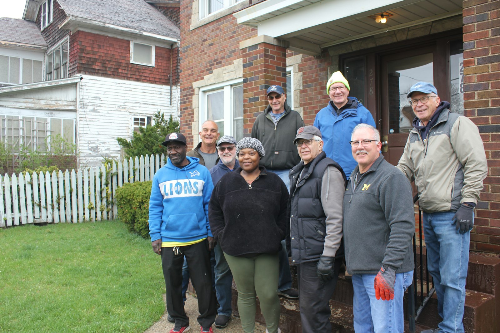 Members of the "Movers and Shakers" pose for a photo with Shajanique Johnson, who called the nonprofit to ask for assistance. “I’m really appreciative of these guys because they literally just furnished my whole house for nothing,” Johnson said.