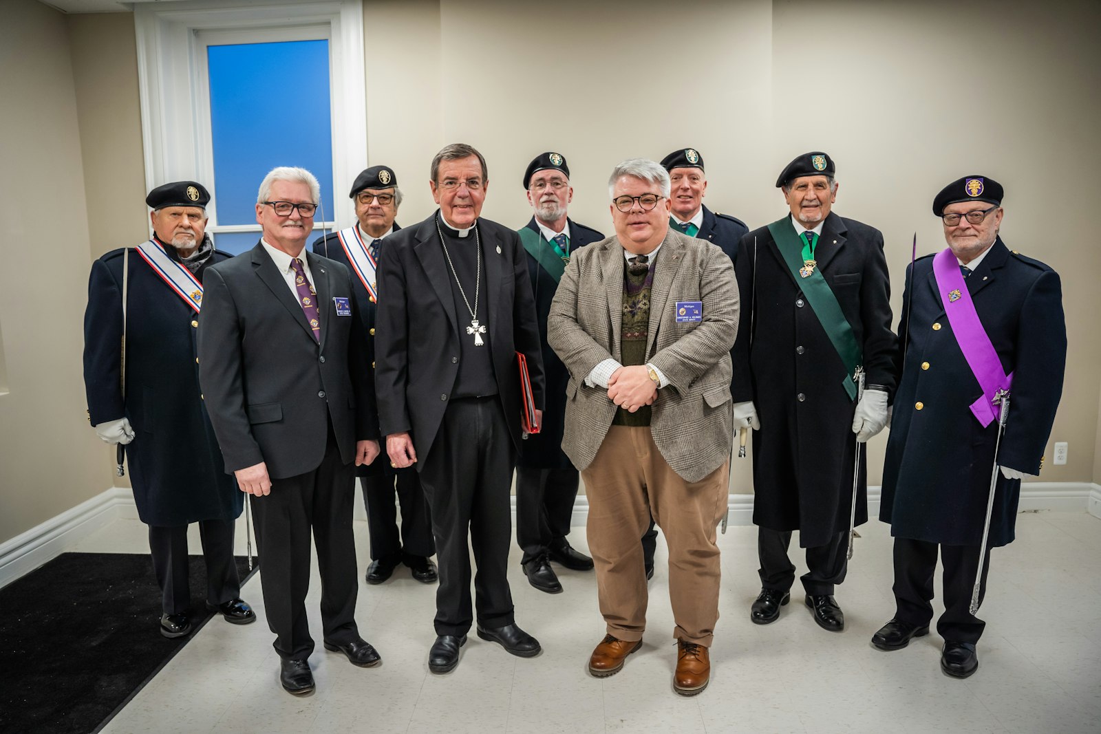 Speaking at the dedication, Knights of Columbus state deputy Christopher Kolomjec (fourth from right) said the Knights plan to continue to support the Heart of Christ Clinic and to support efforts to open similar clinics in each of Michigan's dioceses.