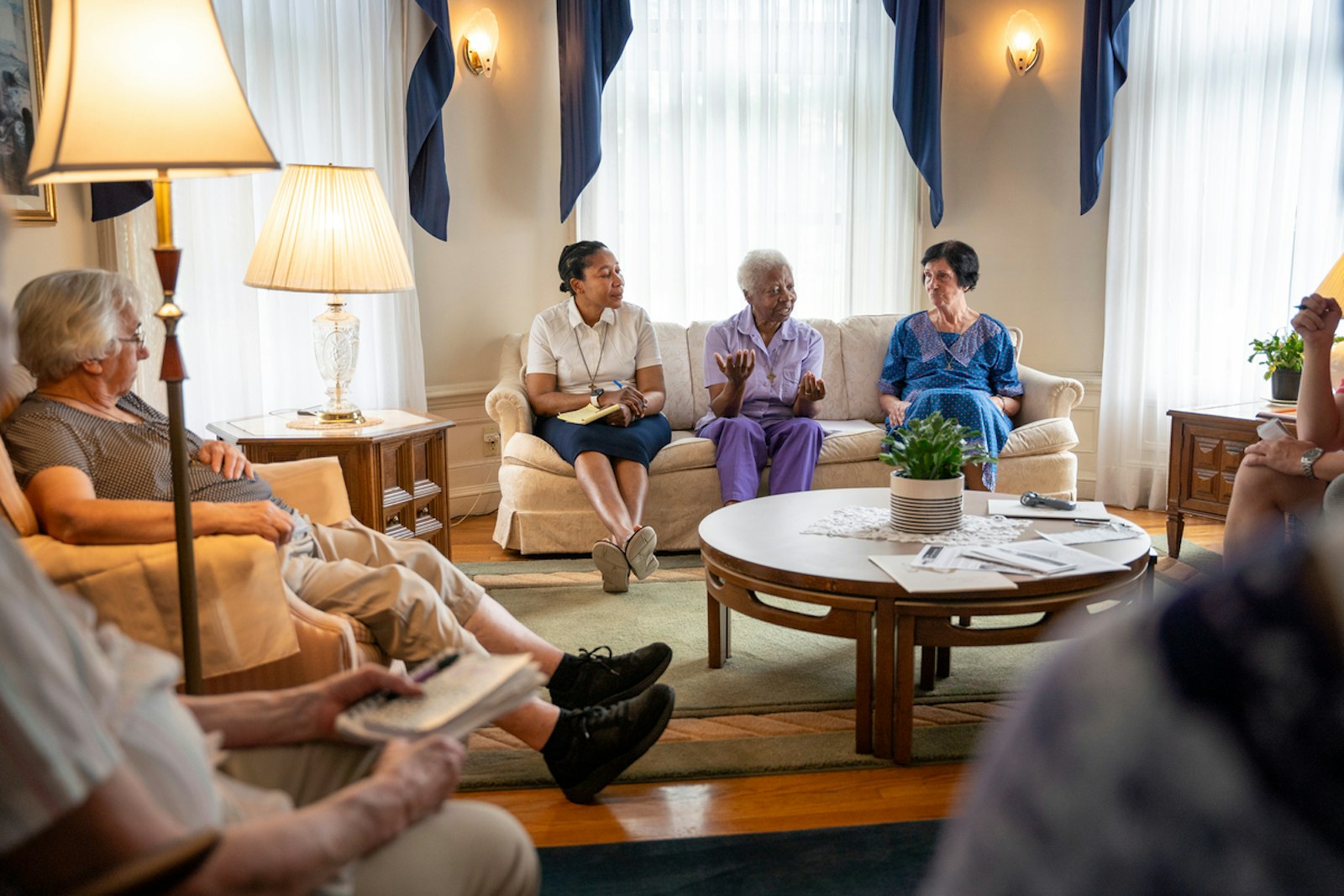 Seven members of the Sisters, Home Visitors of Mary, speak with a reporter in their home in the Boston-Edison neighborhood of Detroit. The community will celebrate its 75th anniversary during a special Mass with retired Detroit Auxiliary Bishop Donald F. Hanchon on Nov. 16 at Sacred Heart Church in Detroit.