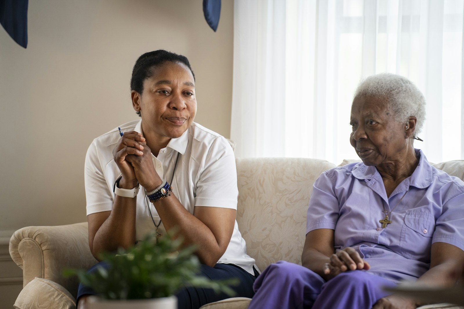 Sr. Clare Emeroum, HVM, left, the community's superior, and Sr. Elizabeth Harris, HVM, recount how they first came into contact with the Sisters, Home Visitors of Mary, during an interview at their convent in the Boston-Edison neighborhood of Detroit.