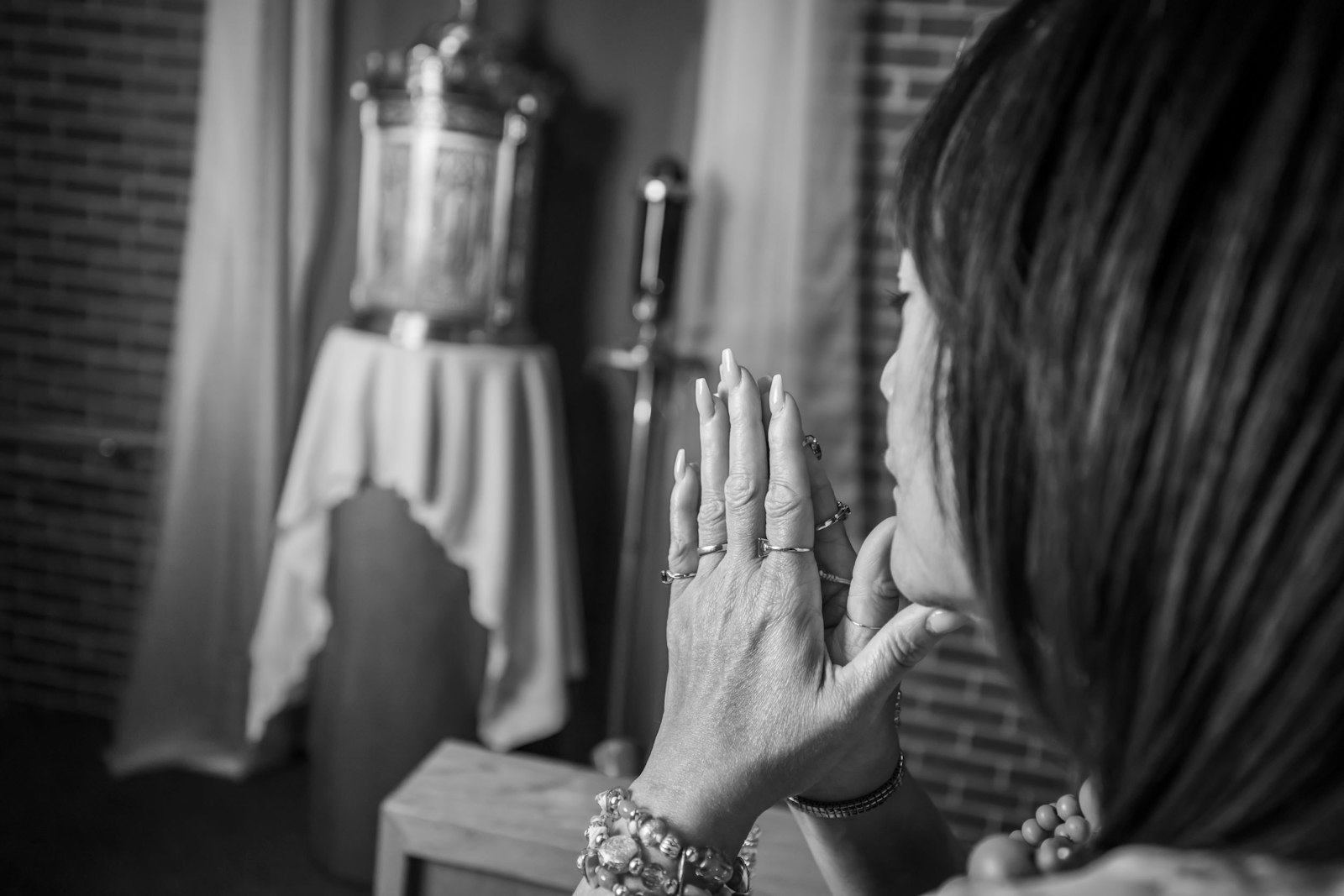 Valerie Berry prays in front of the Blessed Sacrament at Corpus Christi Parish in Detroit. Berry's story will be featured in the new I AM HERE campaign, an effort by the Archdiocese of Detroit and Hallow app to increase Eucharistic devotion as part of the U.S. Conference of Catholic Bishops' National Eucharistic Revival. (Photos by Valaurian Waller | Detroit Catholic)