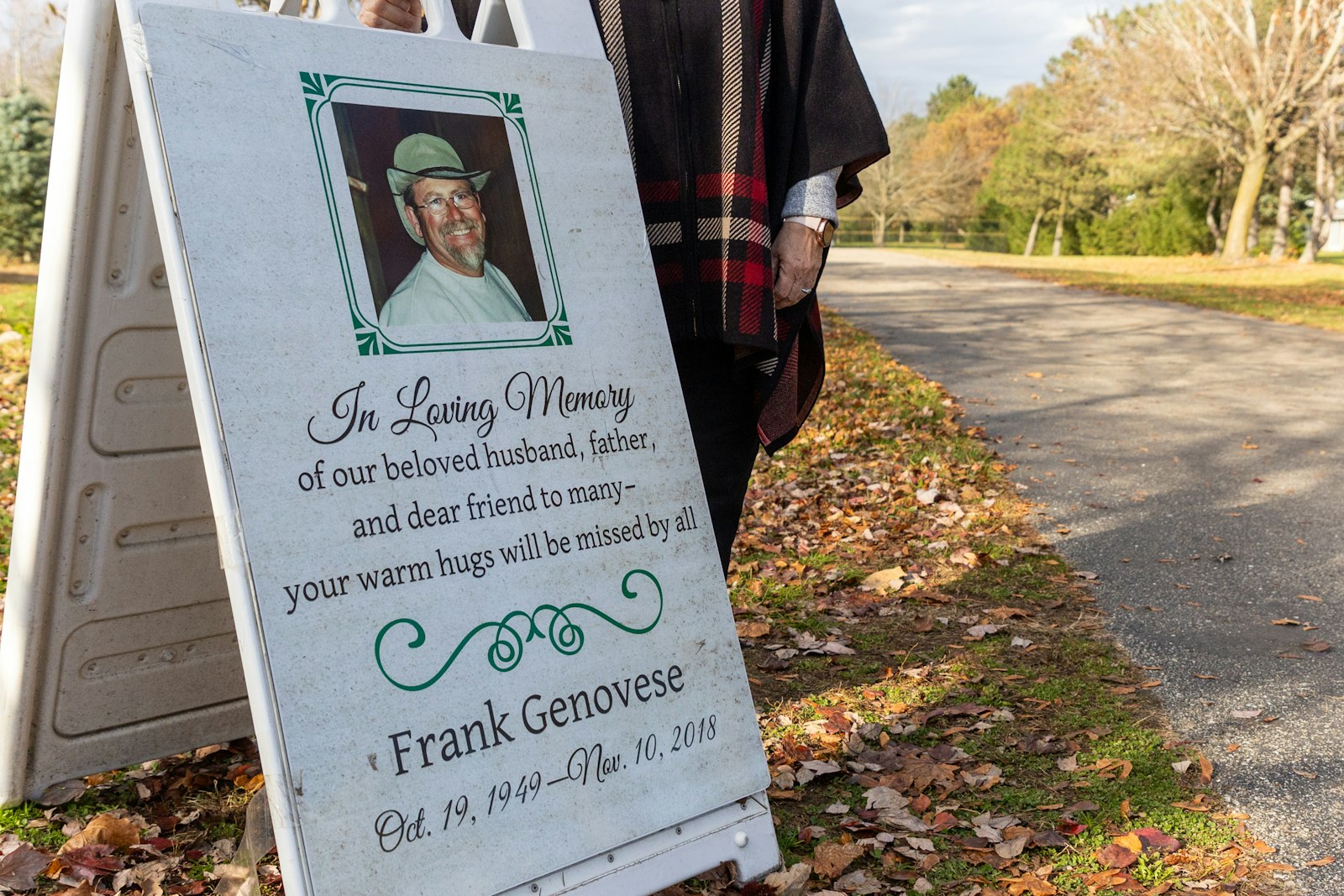 A sign in memory of Frank Genovese is displayed for visitors near the entrance to Candy Cane Christmas Tree Farm.