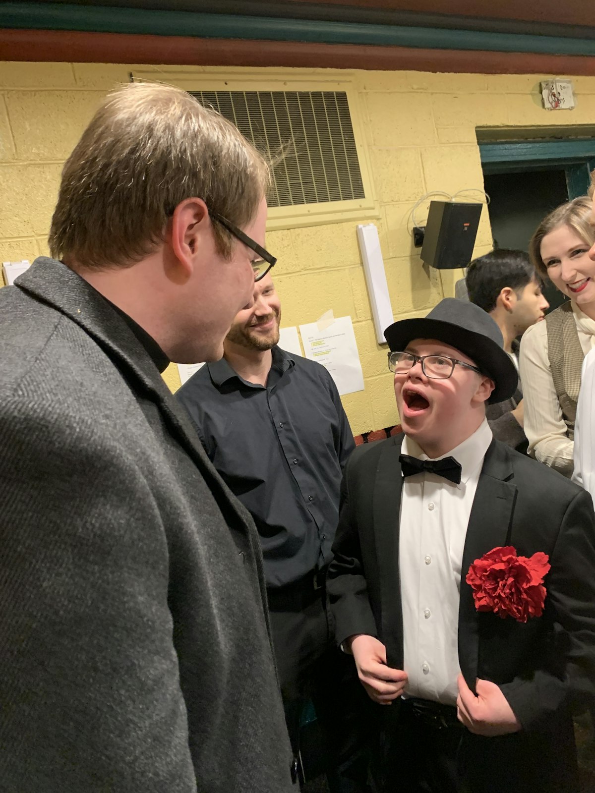 Fr. Caraher meets members of the St. Mary Catholic Central cast in the green room. (Courtesy of St. Mary Catholic Central High School)