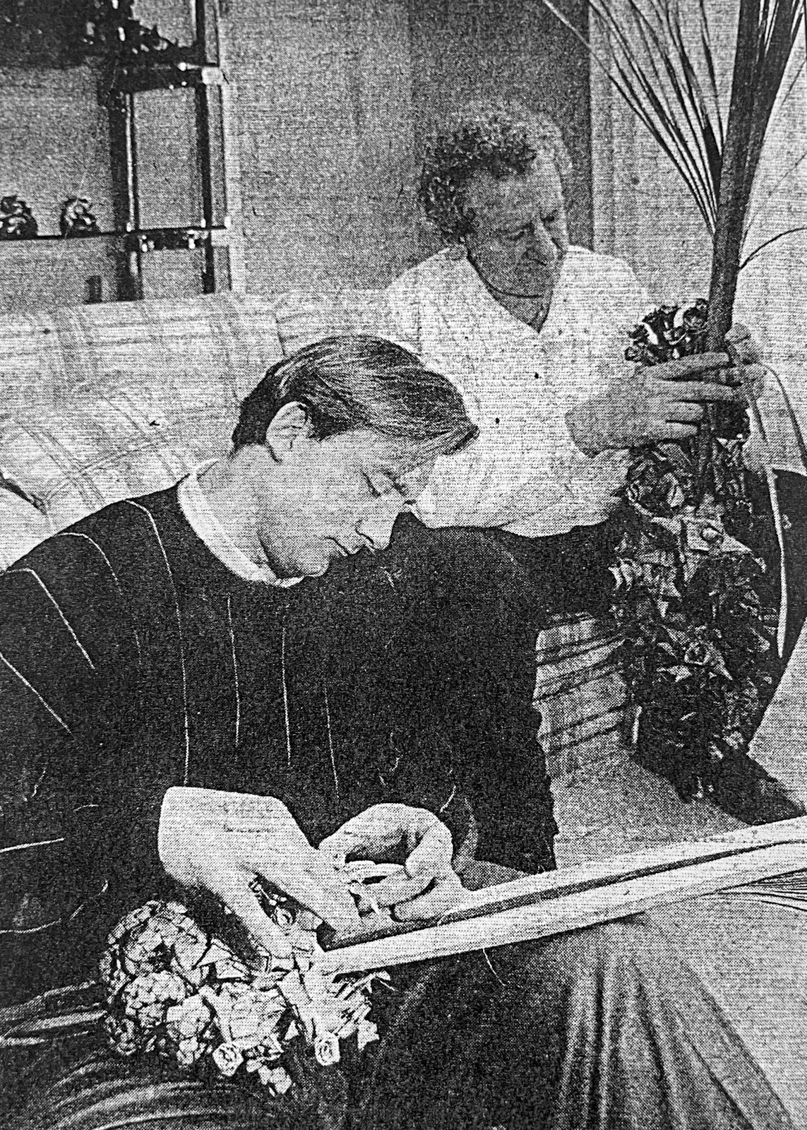 Frederick “Fritz” Wenson, right, and his son Tony Wenson are pictured braiding palms in a photo from a 1991 Detroit News article.