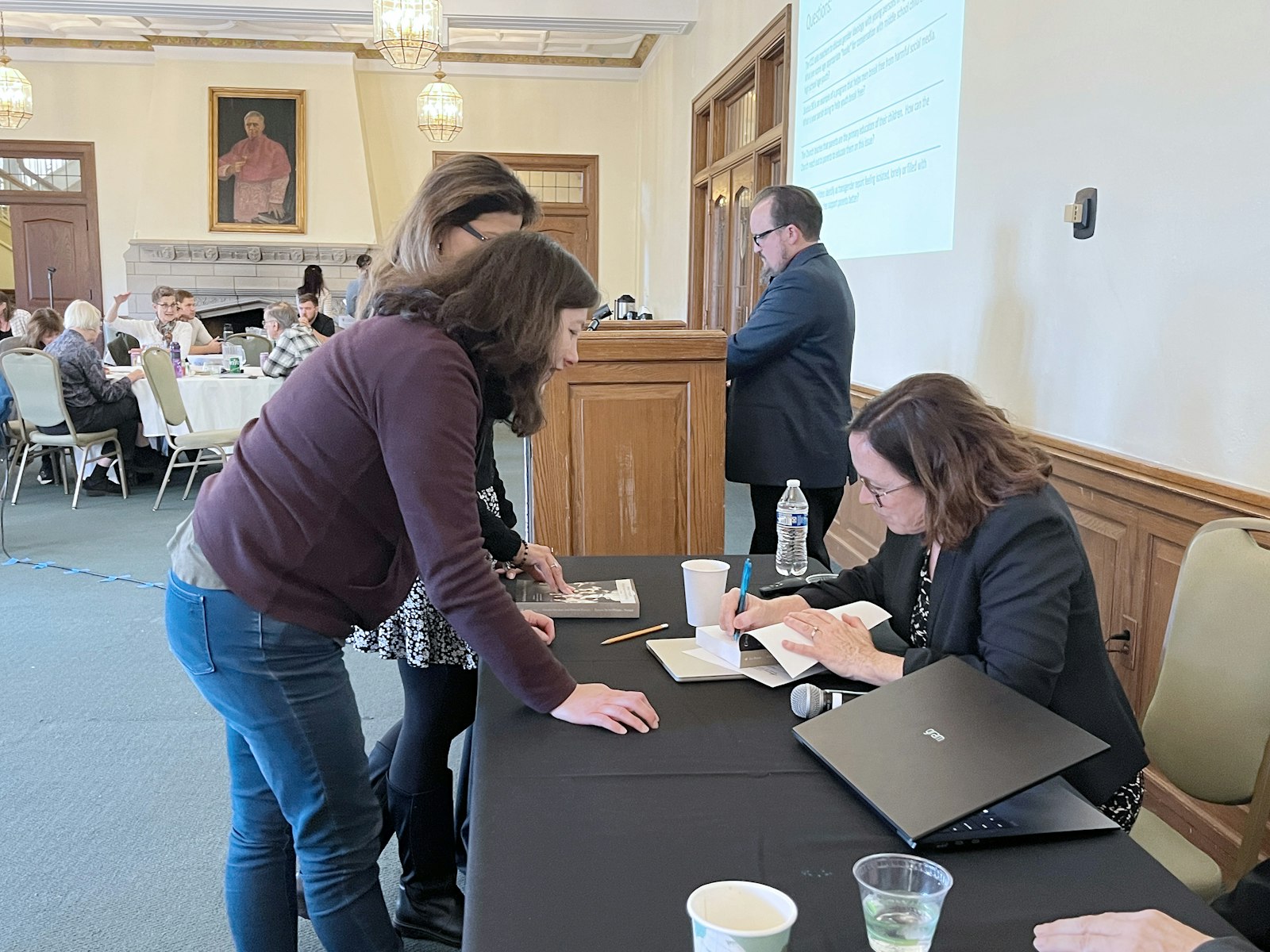 Theresa Farnan signs a copy of her book after her Nov. 7 lecture, “A Pastoral Response to Gender Ideology: Balancing Compassion and Truth in Ministry to Youth Who Experience Body and Identity Related Stress,” part of Sacred Heart Major Seminary's Lay Ecclesial Minister (LEM) speaker series.