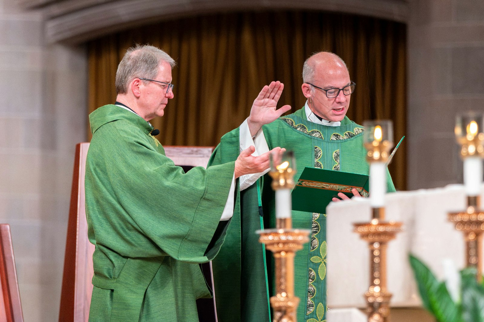 Fr. J.J. Mech, right, celebrates Mass as Deacon Mike Van Dyke assists Sept. 8 at the Cathedral of the Most Blessed Sacrament.