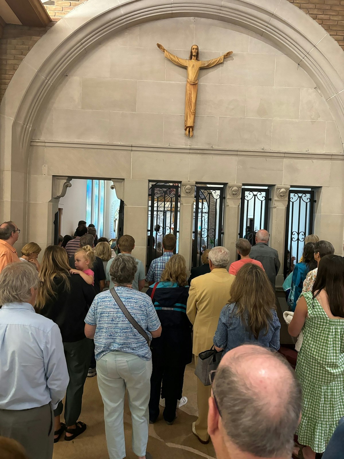 Parishioners gather outside the new adoration chapel at St. Anne Parish in Warren as Fr. John Kopson processes with the Eucharist on June 30. (Photos courtesy of Christine Renner)