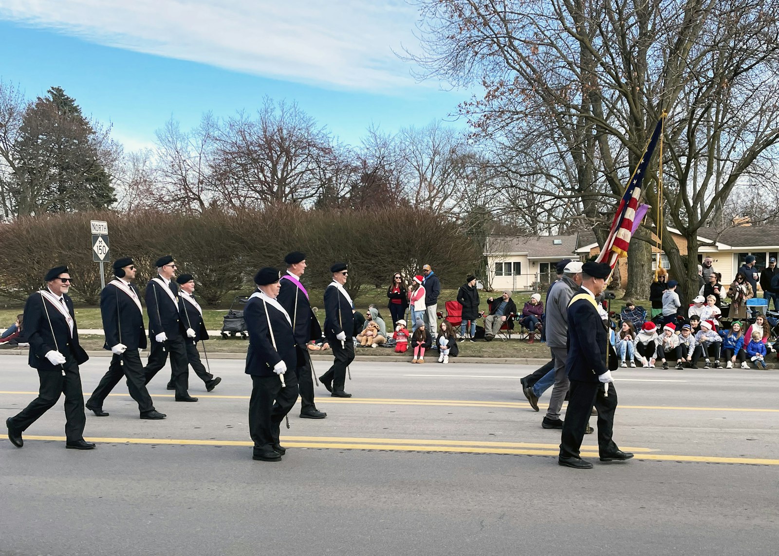 This was the Knights of Columbus' second year working in collaboration with the school and parish, and the Knights' fourth-degree color guard marched in the parade alongside the float. (Photo courtesy of Robert Simpson)