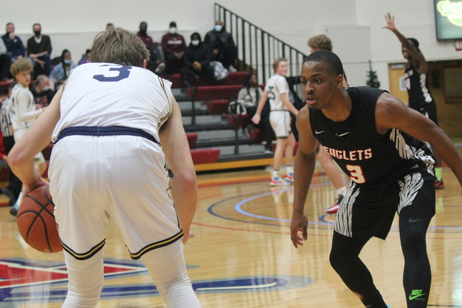 St. Mary’s senior Kareem Rozier looks to steal the ball from Grosse Pointe South’s Anthony Benard. Part of the Eaglets’ game plan was slow down Bernard, South’s top scorer.