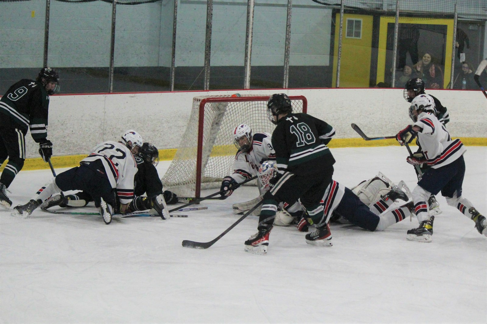 Ann Arbor Fr. Gabriel Richard/Greenhills’ Jack Lapinski (18) has just enough space – and just enough time – to net the game-tying goal with less than a second to play in regulation time.