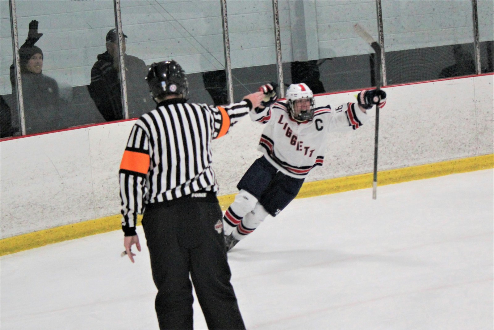 As the referee gives the ‘goal’ signal, University-Liggett senior forward Doug Wood celebrates his overtime game-winner which gave the Knights the Catholic League’s Cardinal Division title.