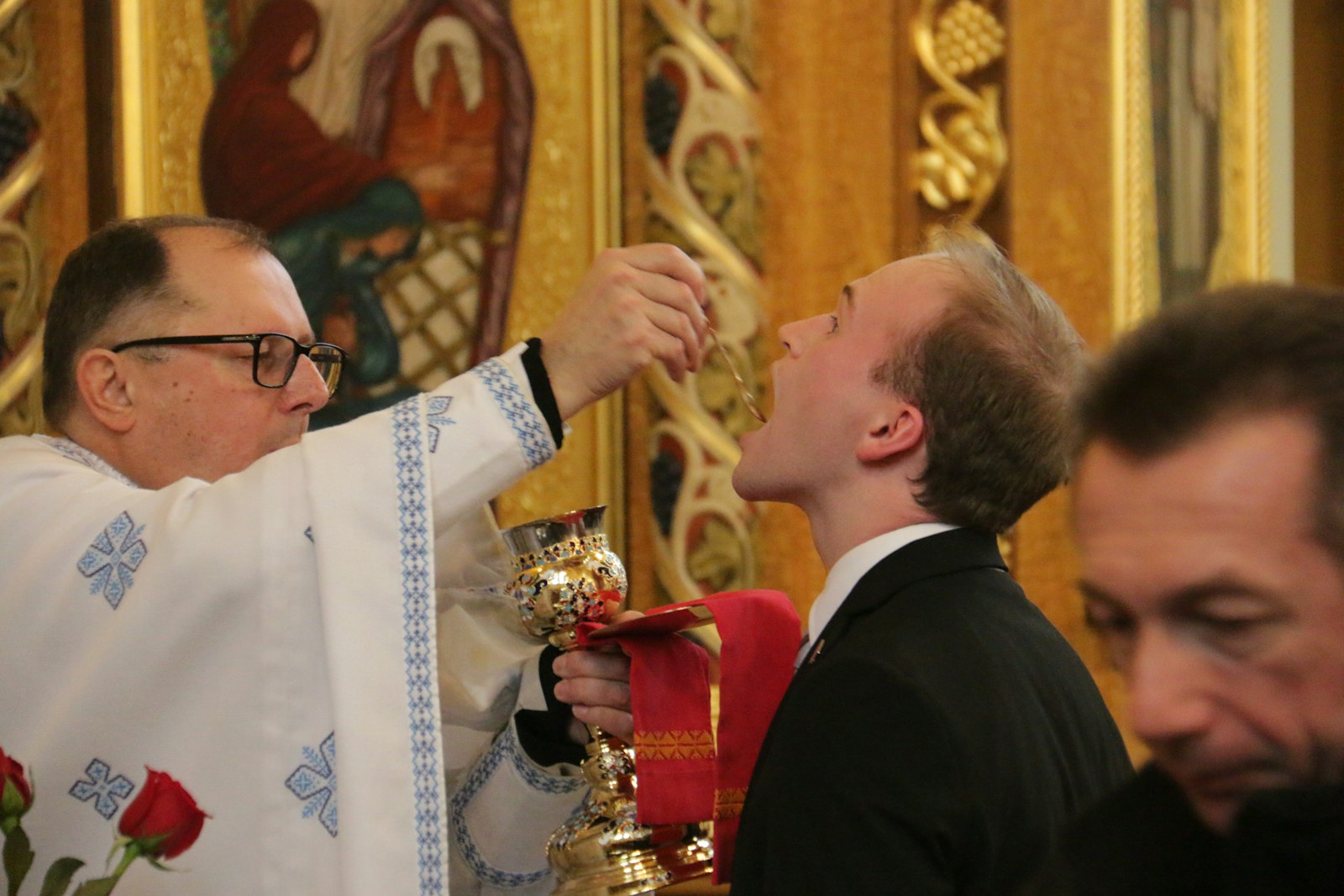 A seminarian receives Holy Communion under both species -- the Sacred Host and the Precious Blood -- as is custom in the Ukrainian Greek Catholic Rite. Fr. Daniel Schaicoski thanked the seminarians for being at Immaculate Conception, praying for peace in Ukraine.