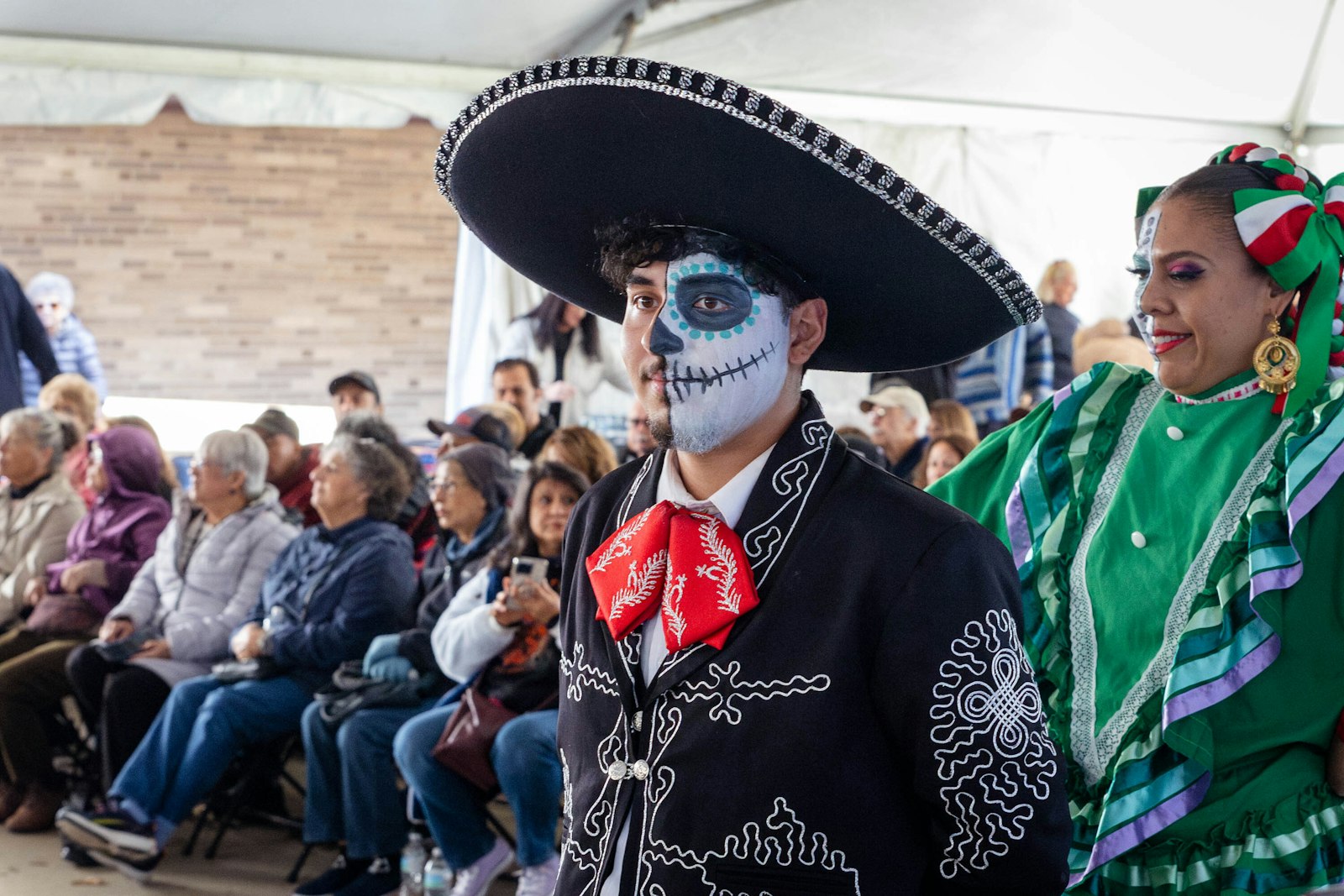 Traditional face paint for Dia de los Muertos depicts a half-painted skull, representing the dual nature of the celebration, which commemorates deceased loved ones while reminding those still living of the realities of heaven.