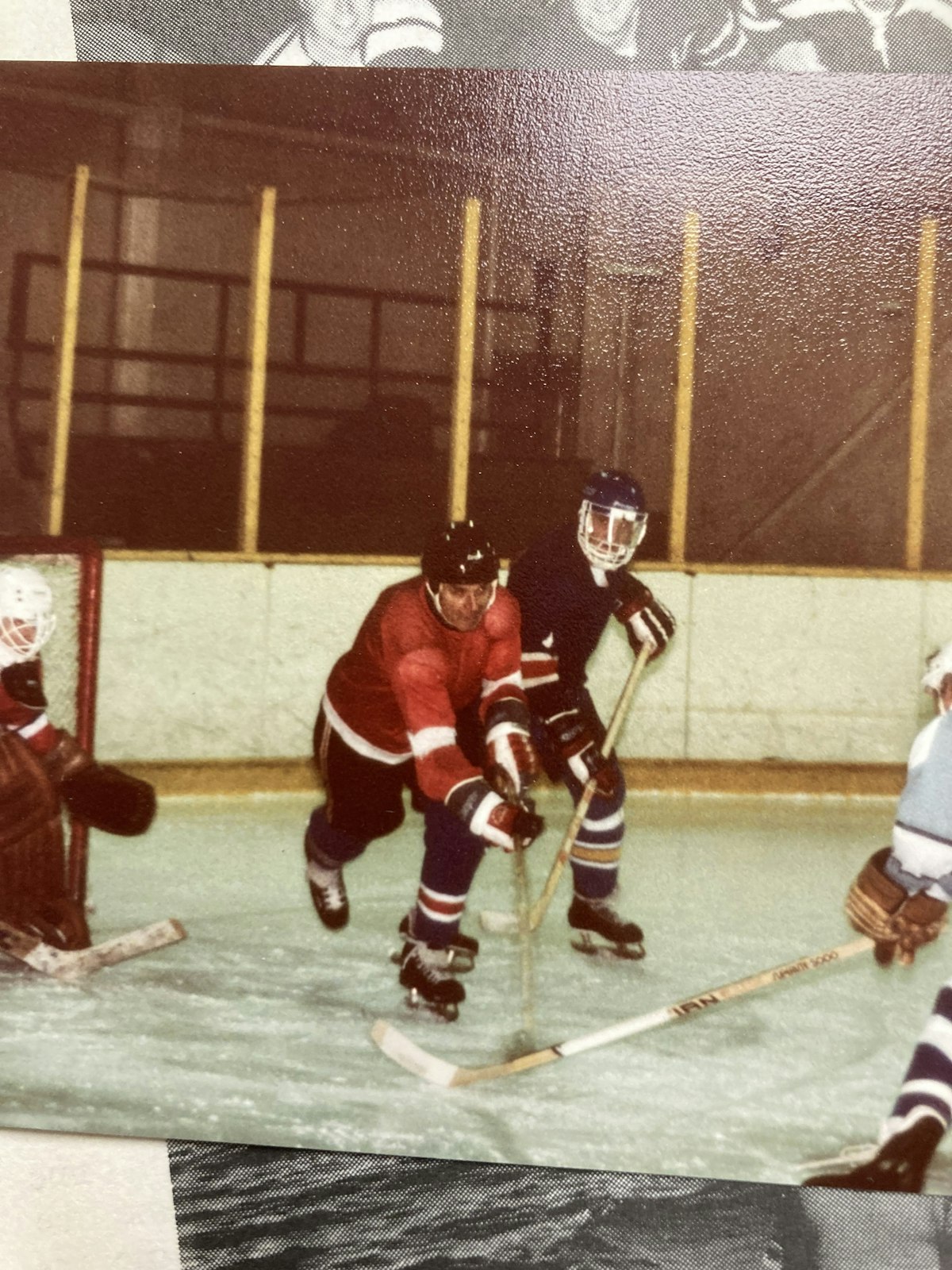 Msgr. Moloney (in red) played ice hockey during his younger days, suiting up as a right winger.