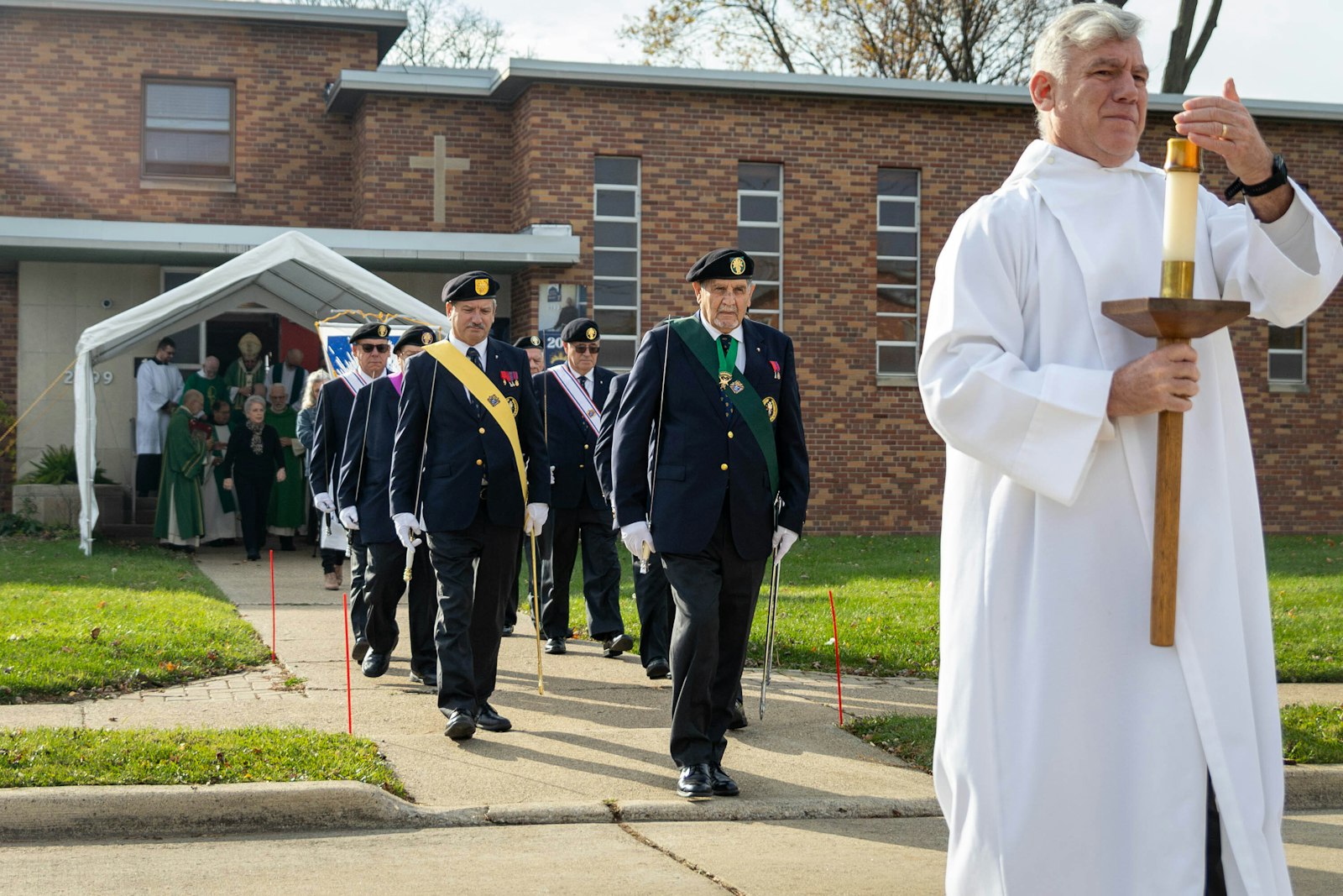 Knights of Columbus lead a procession into the church building to start the Mass. Our Lady of La Salette began with a small community in the 1920s under the patronage of Our Lady of Refuge, eventually changing its name once the Missionaries of La Salette came to the parish in 1932.