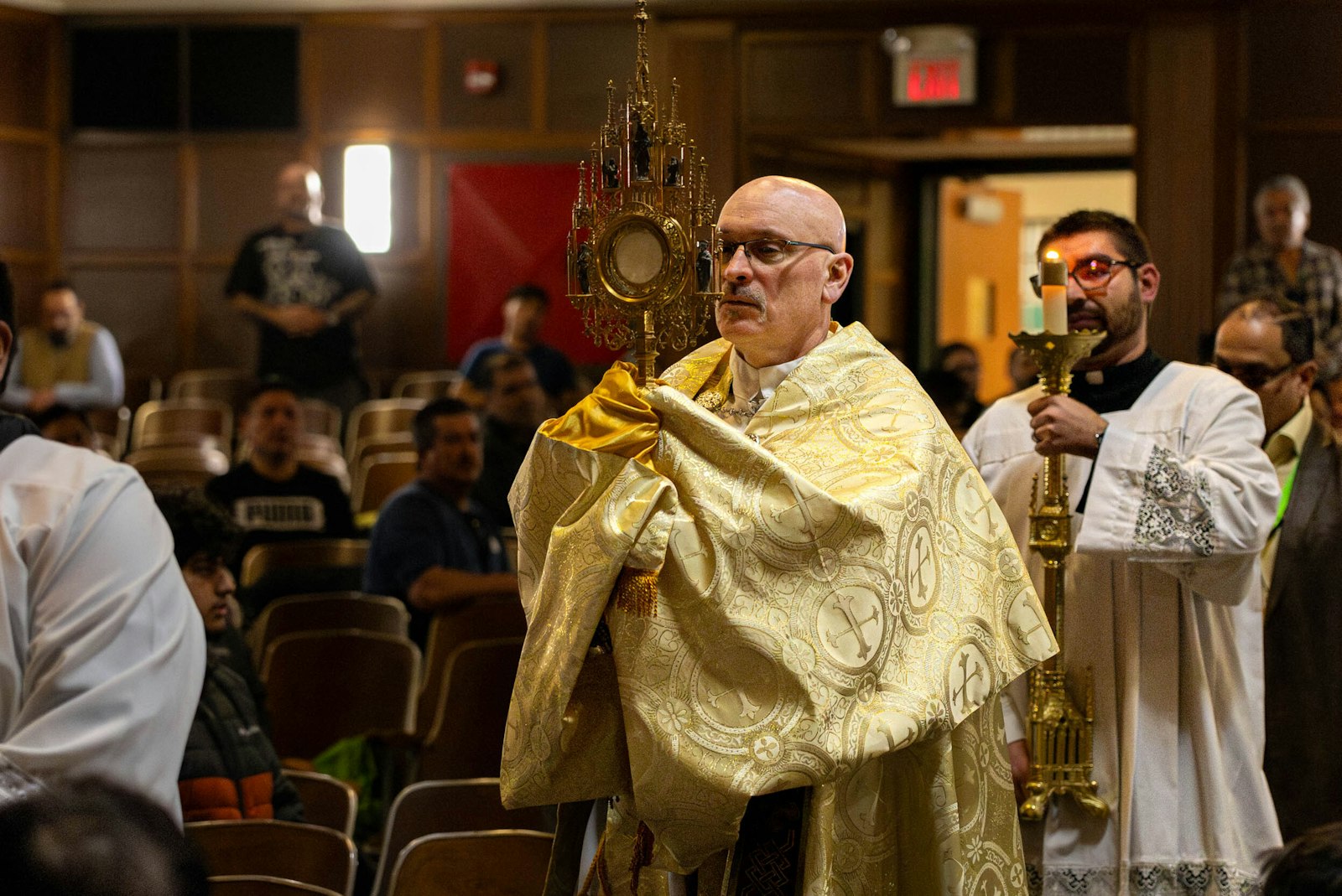 Conference-goers worship Jesus in adoration during the 2024 Hispanic Men's Conference April 14 at Western International High School on Detroit's west side. (Steven Stechschulte | Special to Detroit Catholic)
