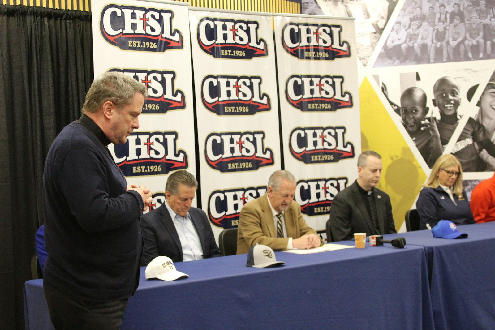 Fr. Brian Lehane, SJ, opens the press conference with a prayer. Members of the media were invited to attend, along with school and (arch)diocesan leaders and supporters.