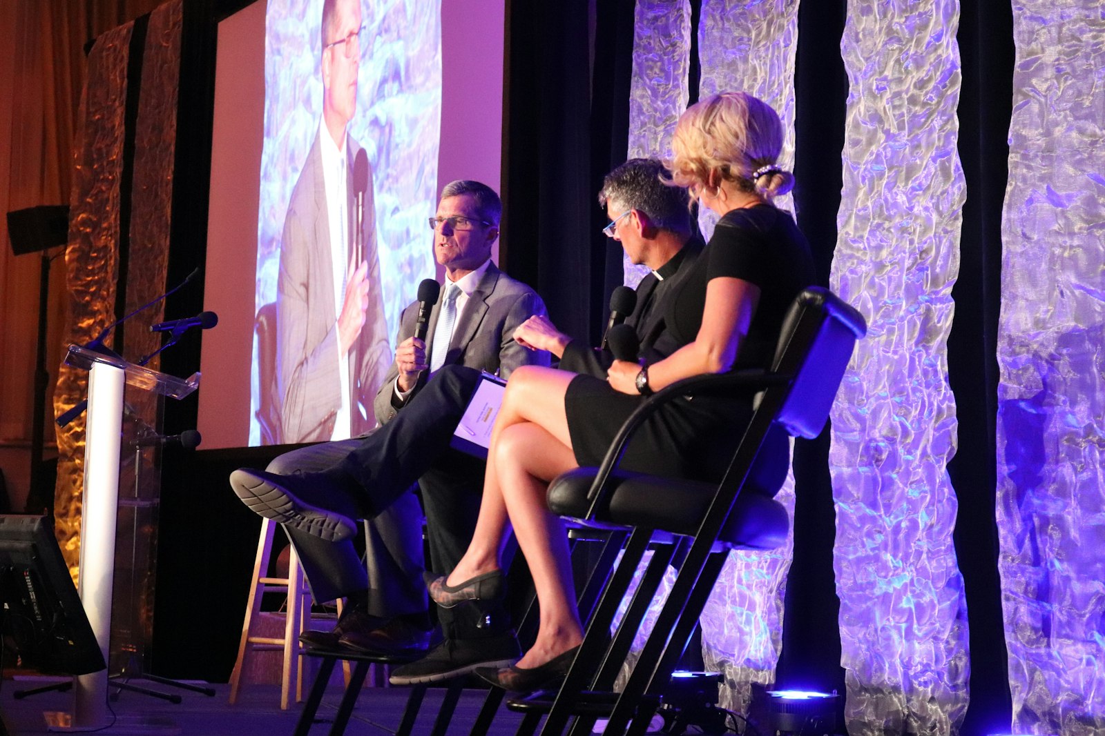 Fr. John Riccardo of Acts XXIX, center, hosts Jim and Sarah Harbaugh in a question-and-answer session about their pro-life advocacy and how their values shape their lives and professions. (Courtesy of John Stockwell)