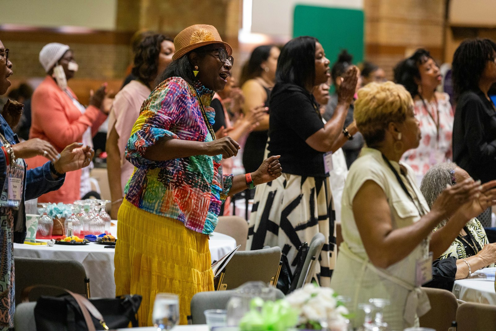 Conference attendees participate in praise and worship at the start of the conference.