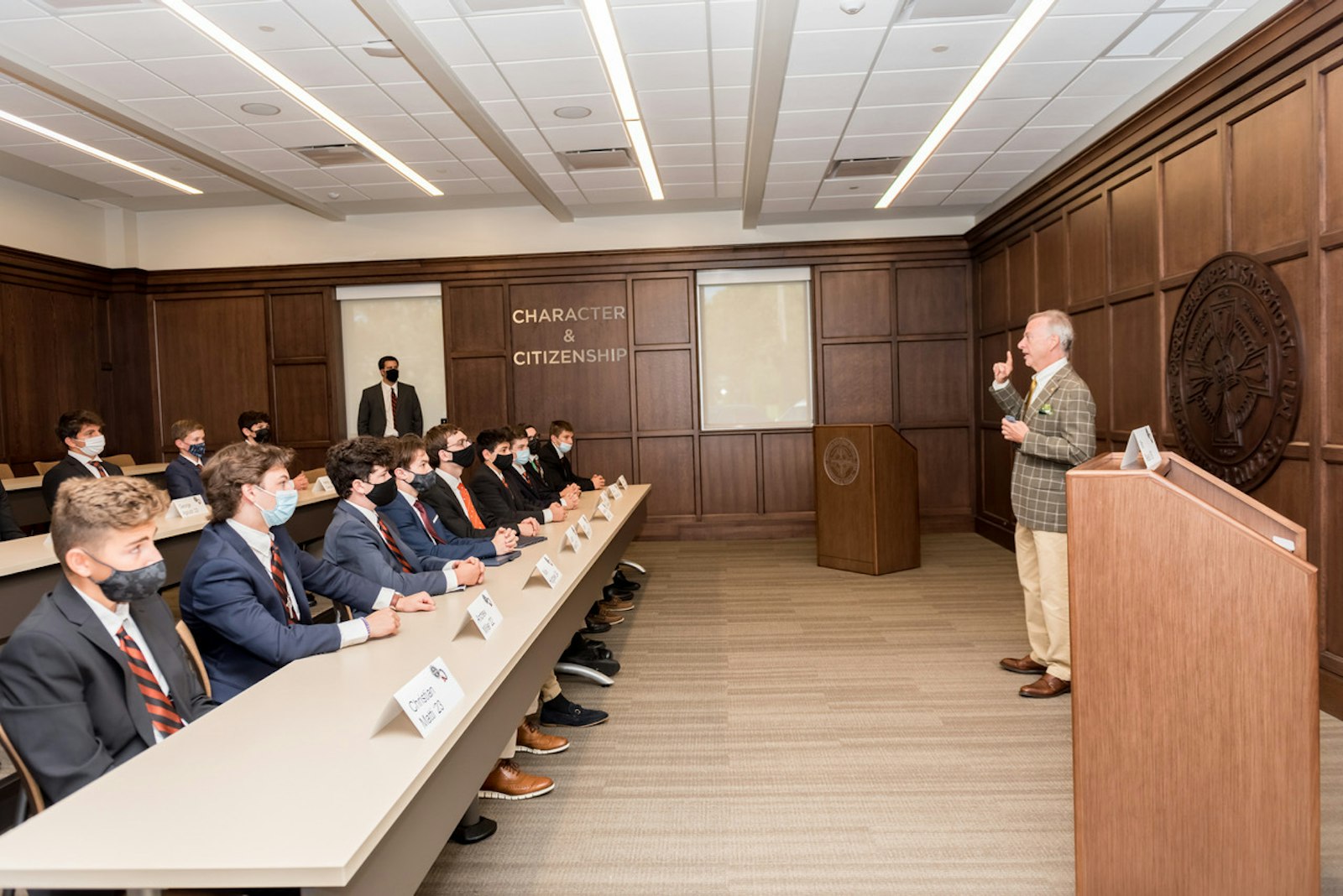 Michael Neus, a Brother Rice alumnus and senior special counsel at the Securities and Exchange Commission (SEC), talks with students in Brother Rice's new Mike Neus Institute for Character and Citizenship, part of the school's campus expansion.