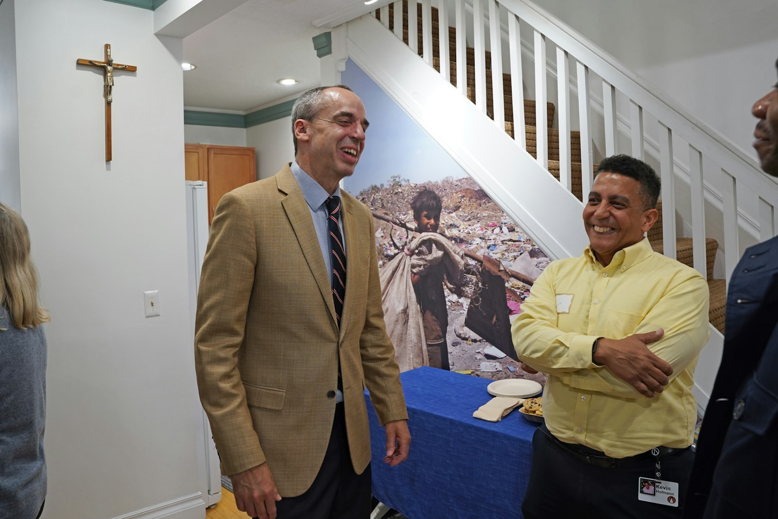 Michael Tenbusch, left, president of International Samaritan, meets with International Samaritan supporter Kevin Hofmann during the April 28 flag-raising ceremony at the organization's headquarters in Ann Arbor.