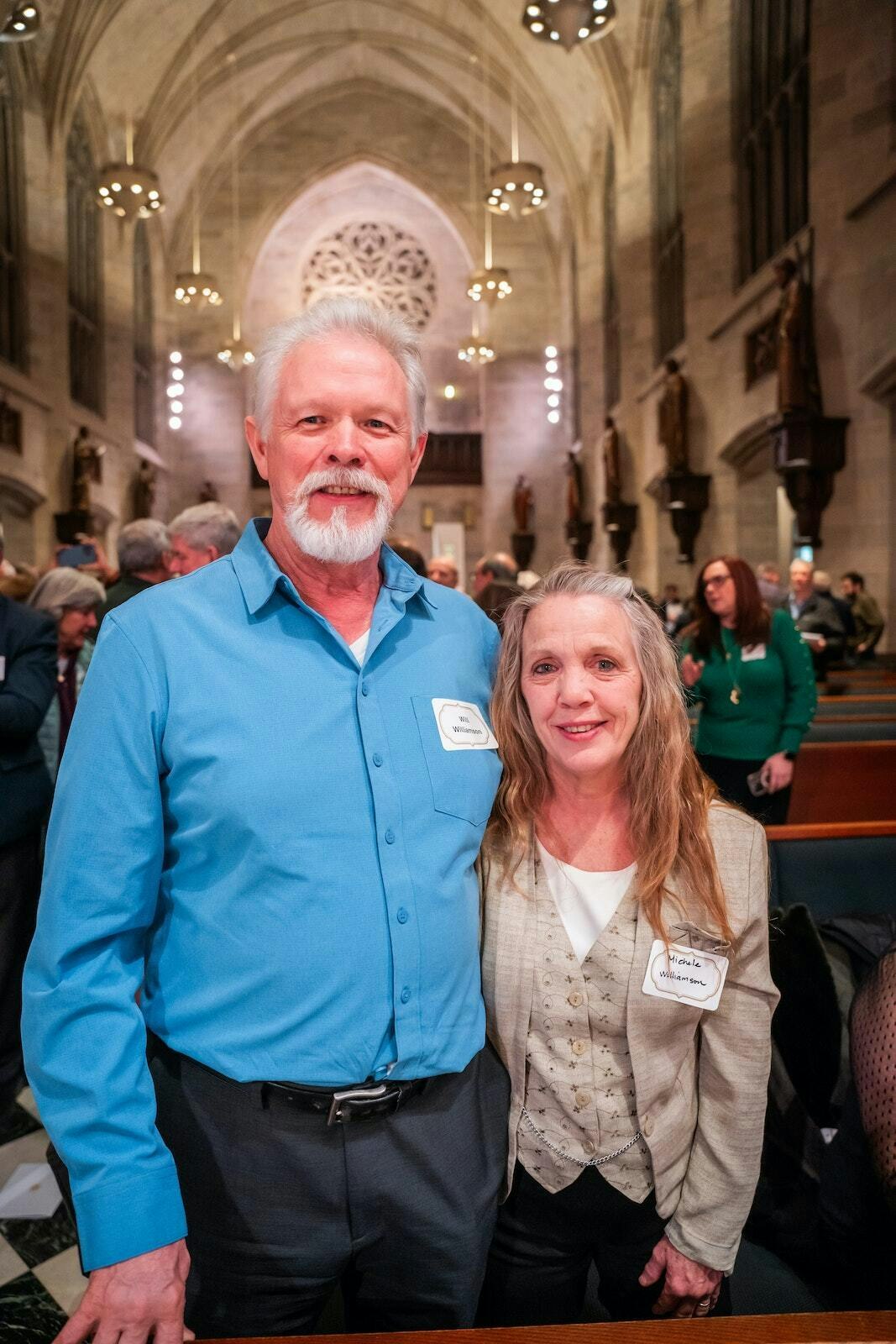 Will Williamson, the craftsman who installed the statue pedestals, is pictured with his wife, Michele, before the dedication ceremony at the Cathedral of the Most Blessed Sacrament.