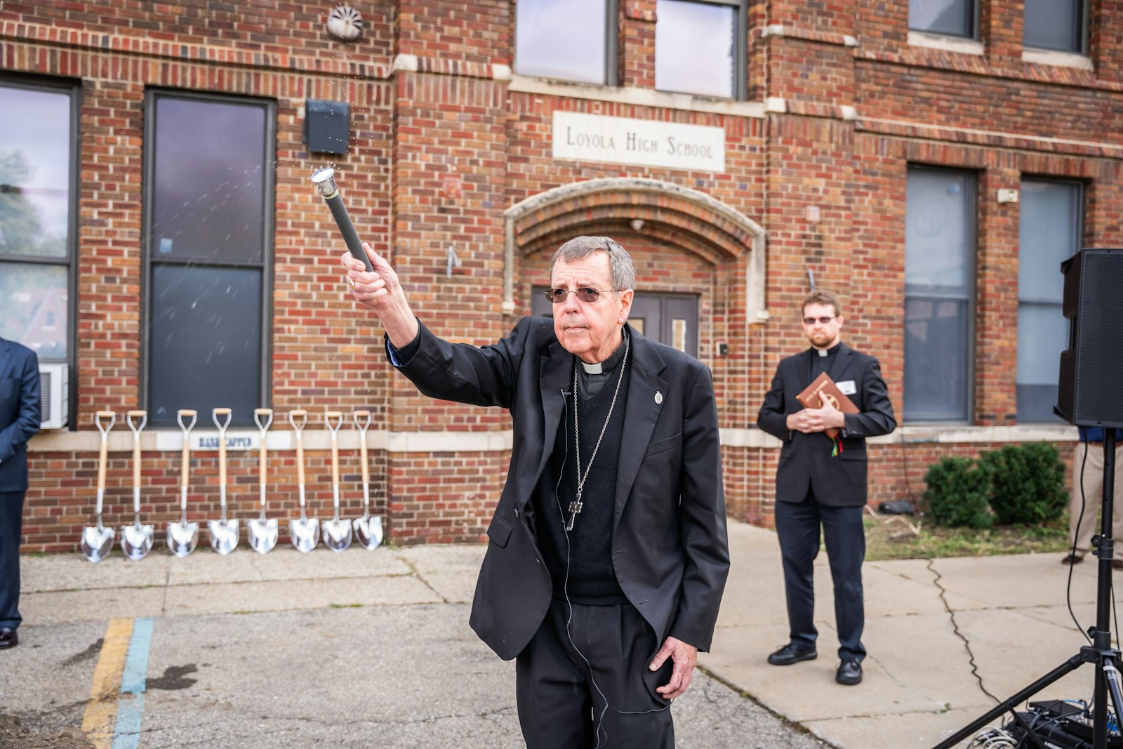 Archbishop Allen H. Vigneron blesses the site of the future St. Peter Claver Chapel on the campus of Loyola High School in northwest Detroit on Sept. 13.