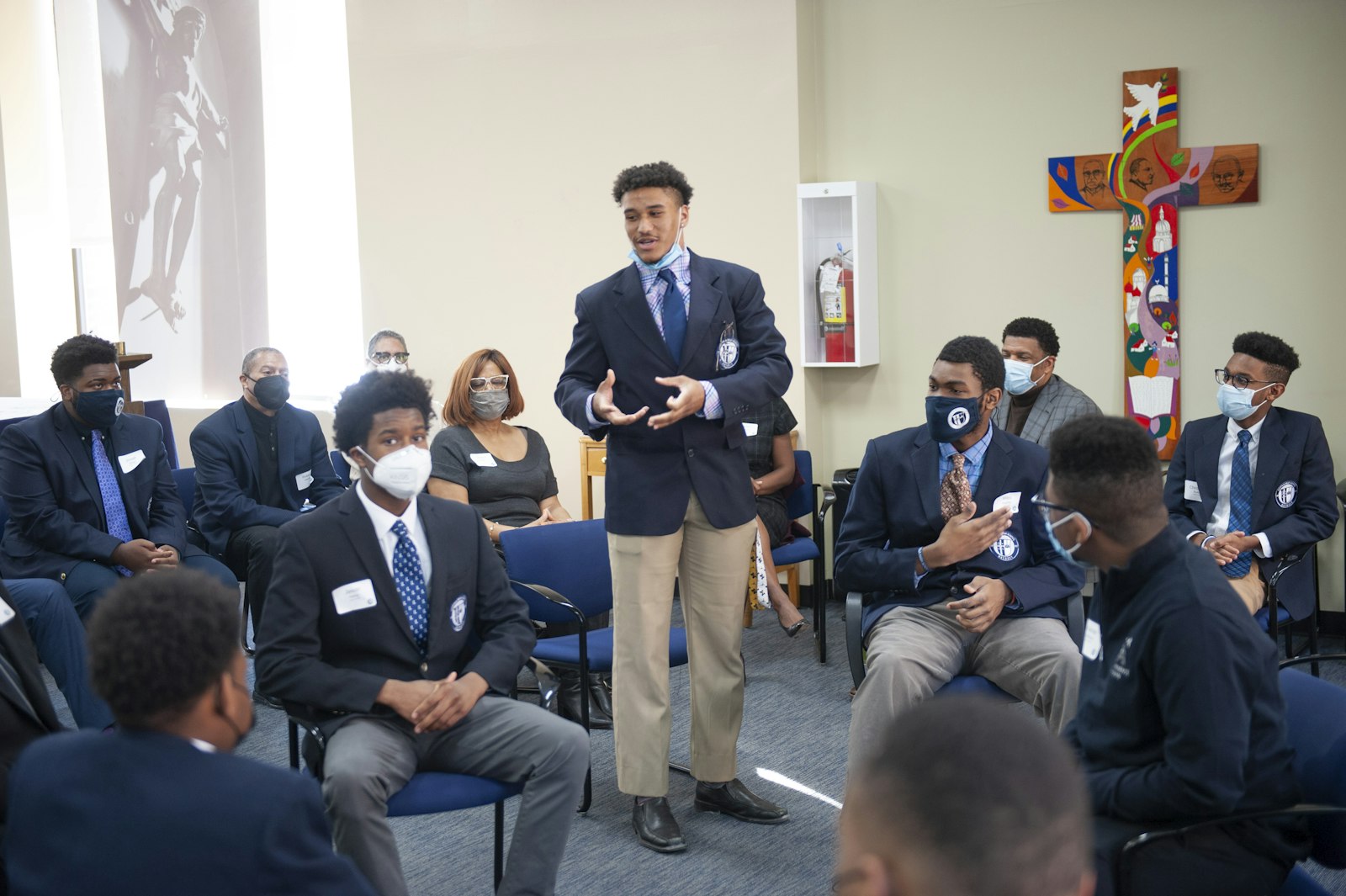 A Loyola High School student talks about what the school means to him during a roundtable with supporters of the school following the scholarship announcement Feb. 14, Frederick Douglass Day.