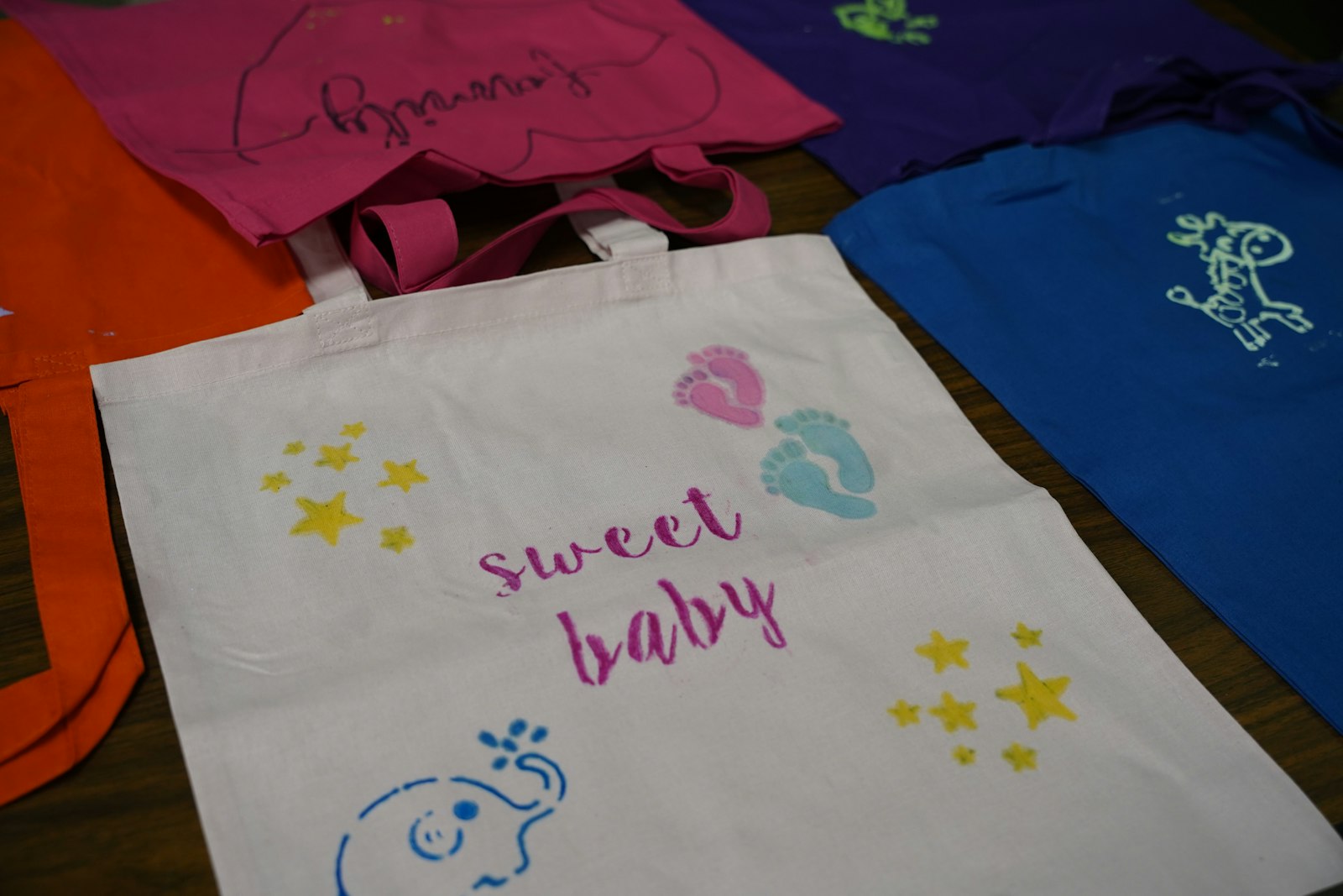 Young people from Divine Child and Sacred Heart parishes in Dearborn made bags for baby supplies for expecting mothers, writing messages of support on the bags. (Photo by Izzy Cortese | Detroit Catholic)