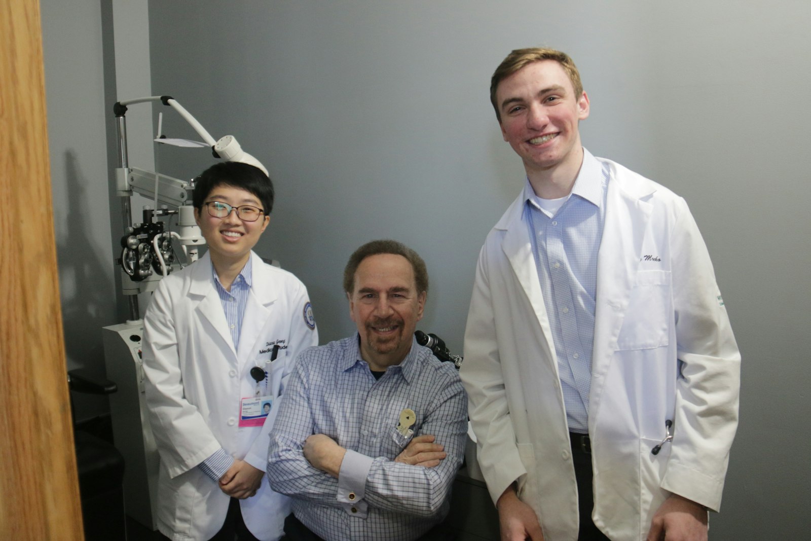 Dr. Joel Pelavin of Eastside Eye Physicians in St. Clair Shores will be providing free checkups and consultations once a month at the eye clinic, working alongside medical students like Diana Jeong (left) of Oakland University's William Beaumont School of Medicine, and Anthony Mrocko (right) of Wayne State University's School of Medicine.