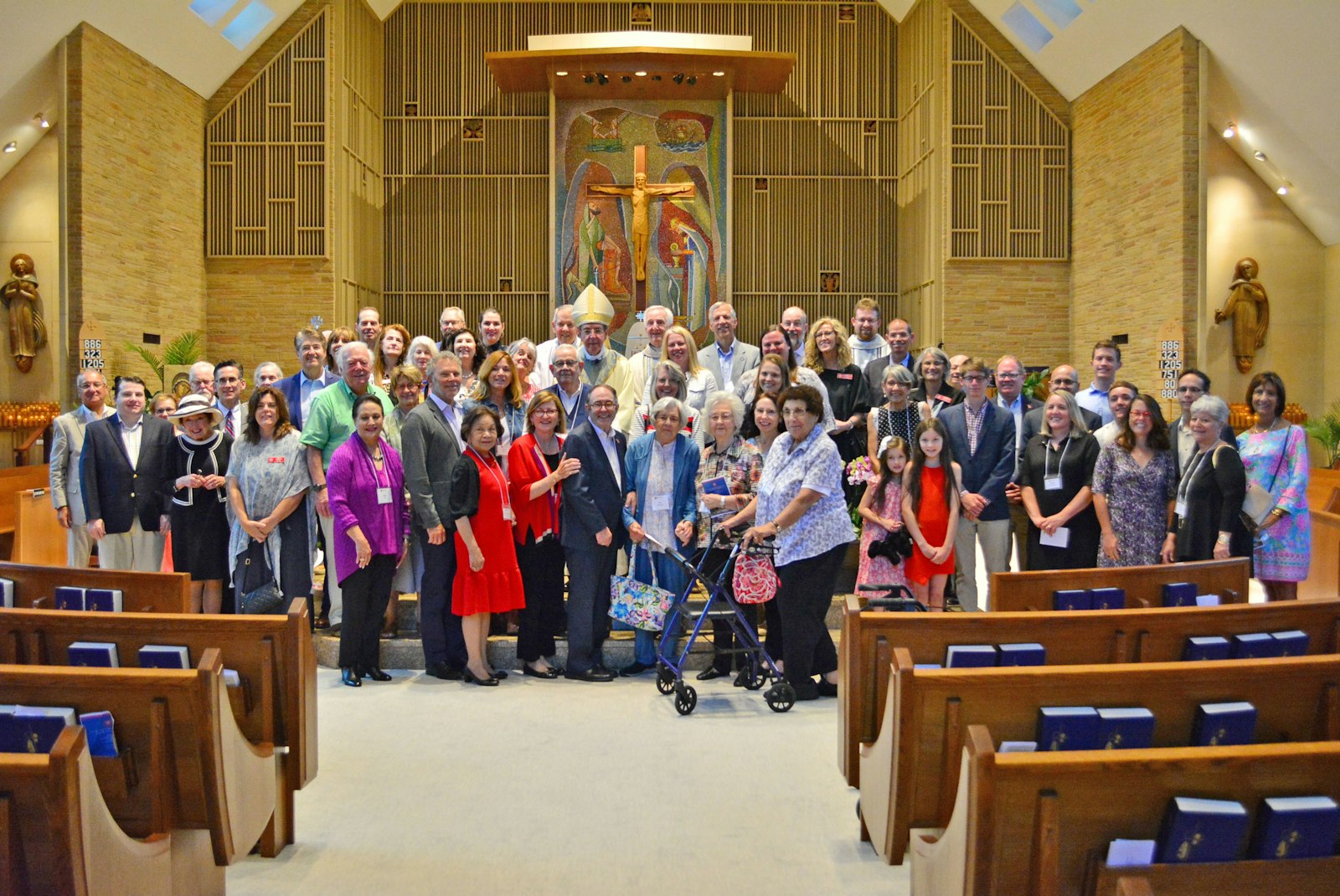 Members of the Order of Malta's Michigan Area pose for a photo with Detroit Archbishop Allen H. Vigneron at Holy Name Parish in Birmingham. The archbishop celebrated Mass on Aug. 14, the vigil of the Solemnity of the Assumption, with members of the order.