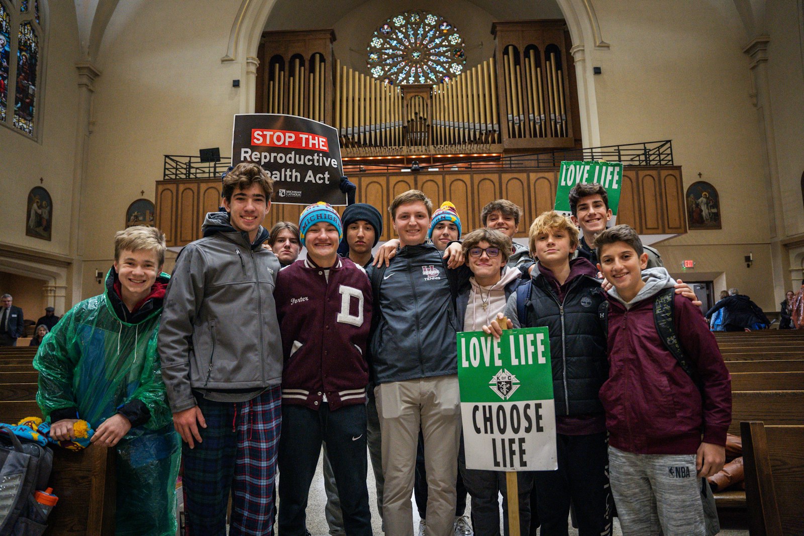 Students from University of Detroit Jesuit High School pose for a photo after the Mass for Life in St. Mary's Cathedral in Lansing.