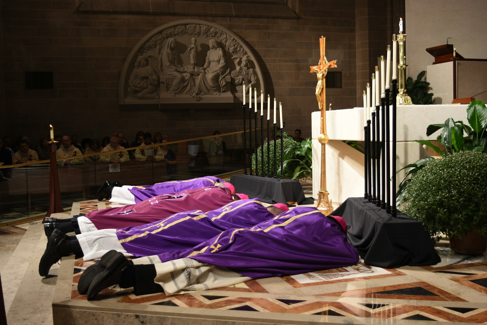 Archbishop Allen H. Vigneron and Detroit's auxiliary bishops lie prostrate before the altar at the Cathedral of the Most Blessed Sacrament during a Mass for Pardon in October 2016. The Mass, which served as a precursor to the synod, asked God to forgive the Church and its leaders for ways in which the Gospel had been hindered by sin, inaction and indifference. (Daniel Meloy | Detroit Catholic)
