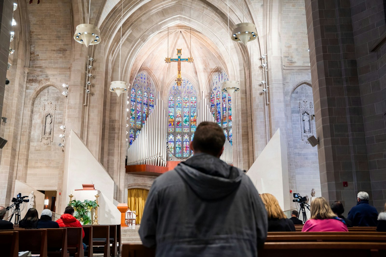 A man gazes up to the expansive stained-glass windows of the Cathedral of the Most Blessed Sacrament during the Mass for the Protection of the Unborn on Jan. 23.