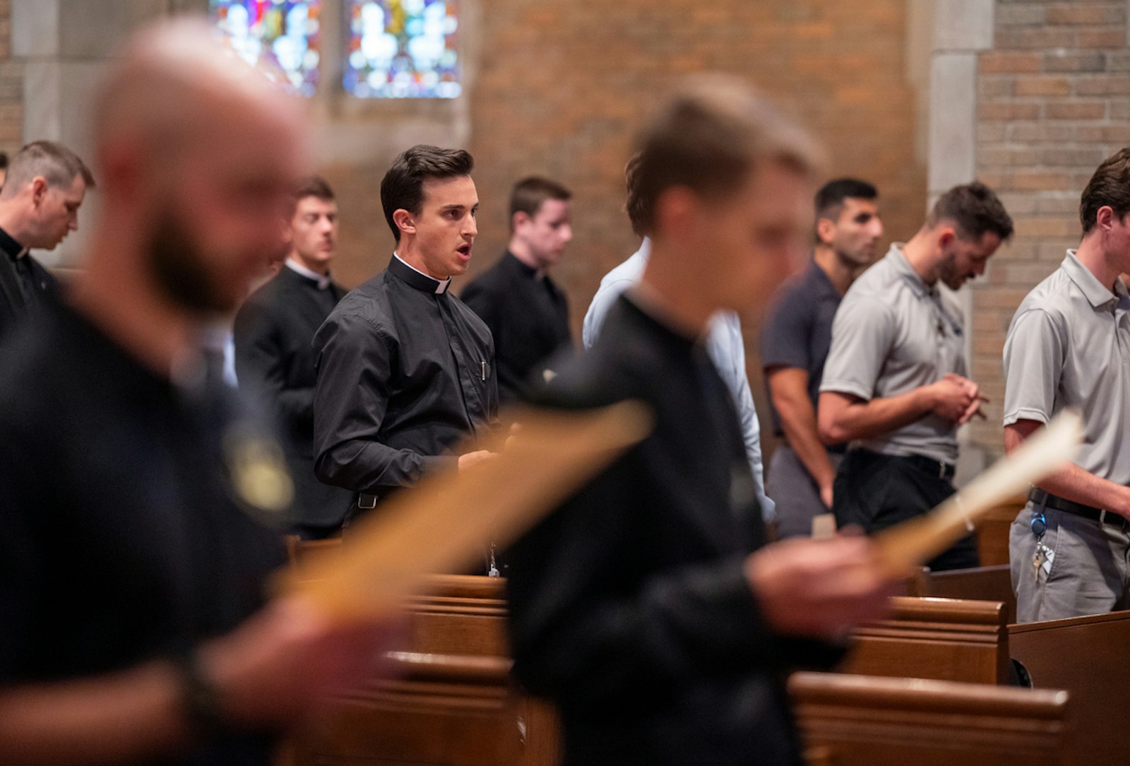 Seminarians sing during the Mass of the Sacred Heart. This year, 94 seminarians from nearly a dozen dioceses and religious communities will continue or begin their priestly formation at Sacred Heart.