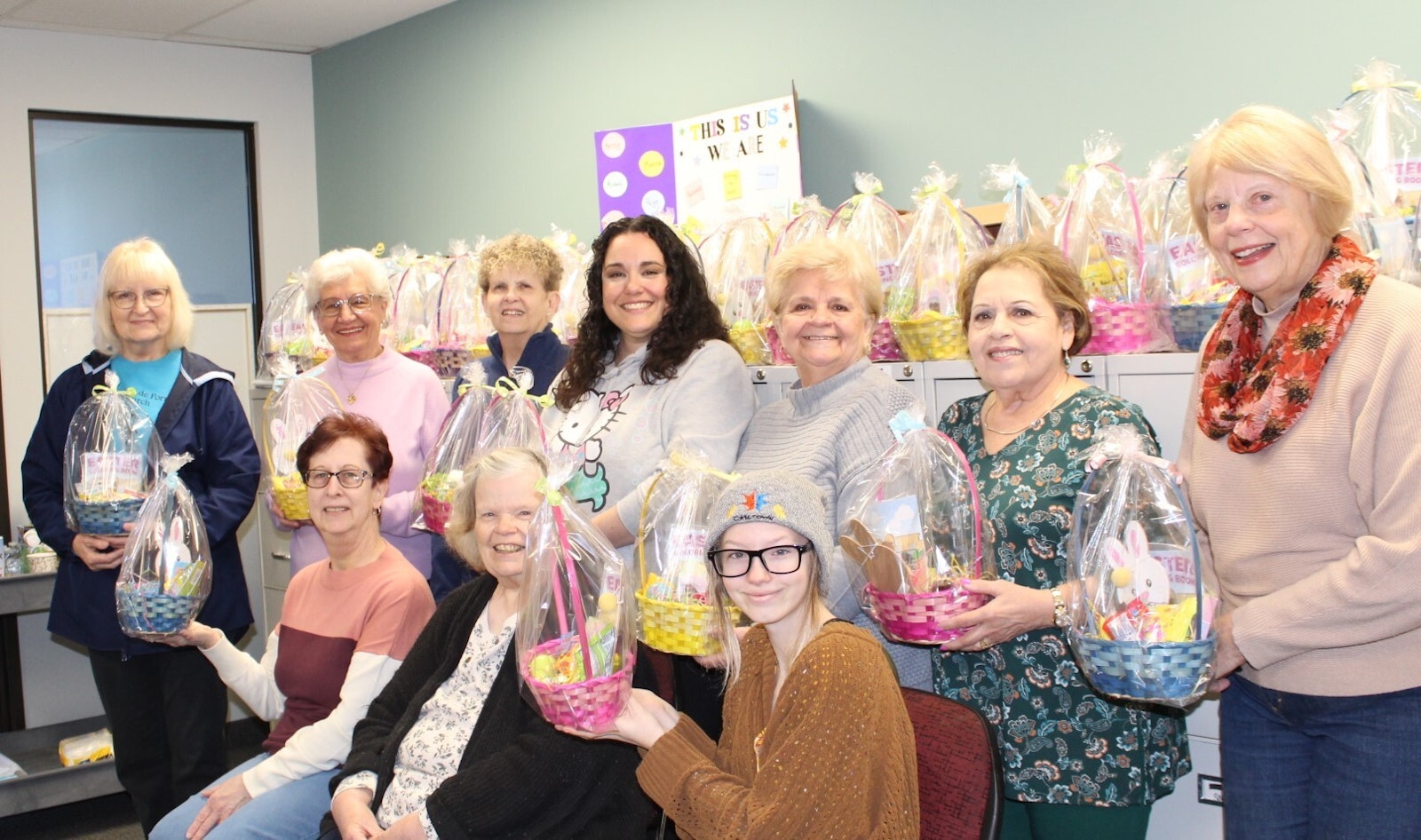 Members of the Council of Catholic Women of the Archdiocese of Detroit show the Easter baskets they assembled on March 16. The baskets will be delivered to foster families in Metro Detroit.
