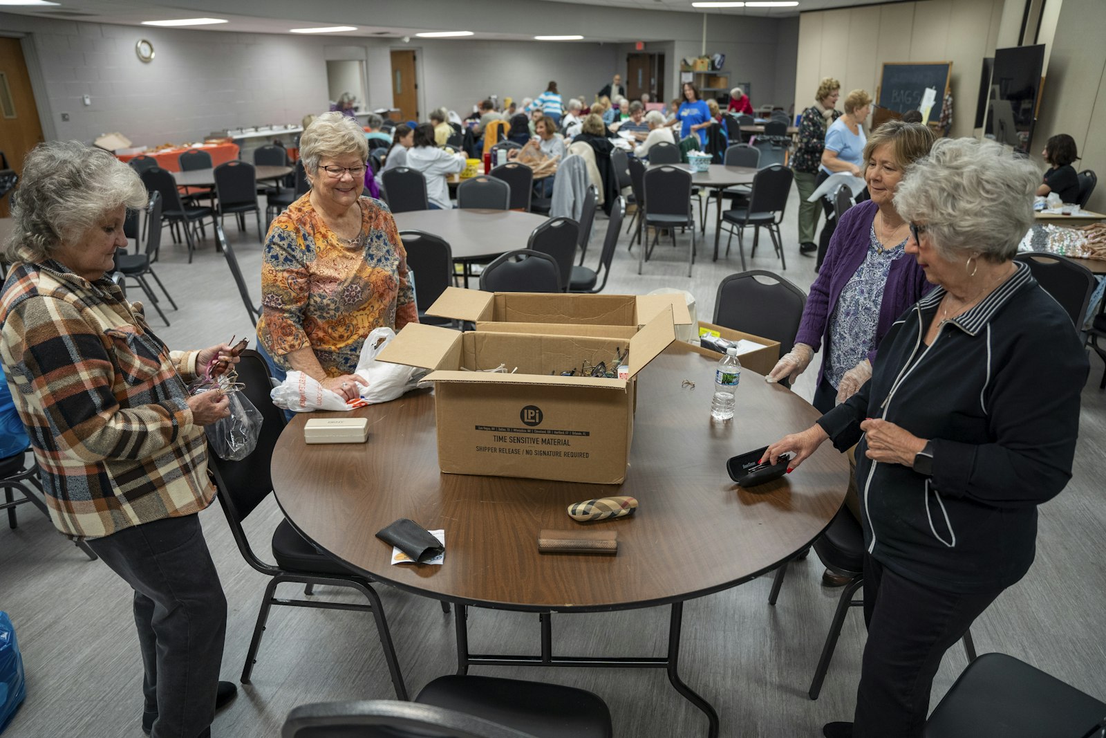 Geri Overholser, Bonnie Latorre, Sue Rakowski and Kathy Nevedal box donated glasses and hearing aids at St. Michael Parish during the Mercy in Action Day of Service event on Oct. 19. Parishioners across the Archdiocese of Detroit performed corporal works of mercy either in their own parishes or out in the community for the eighth annual event.