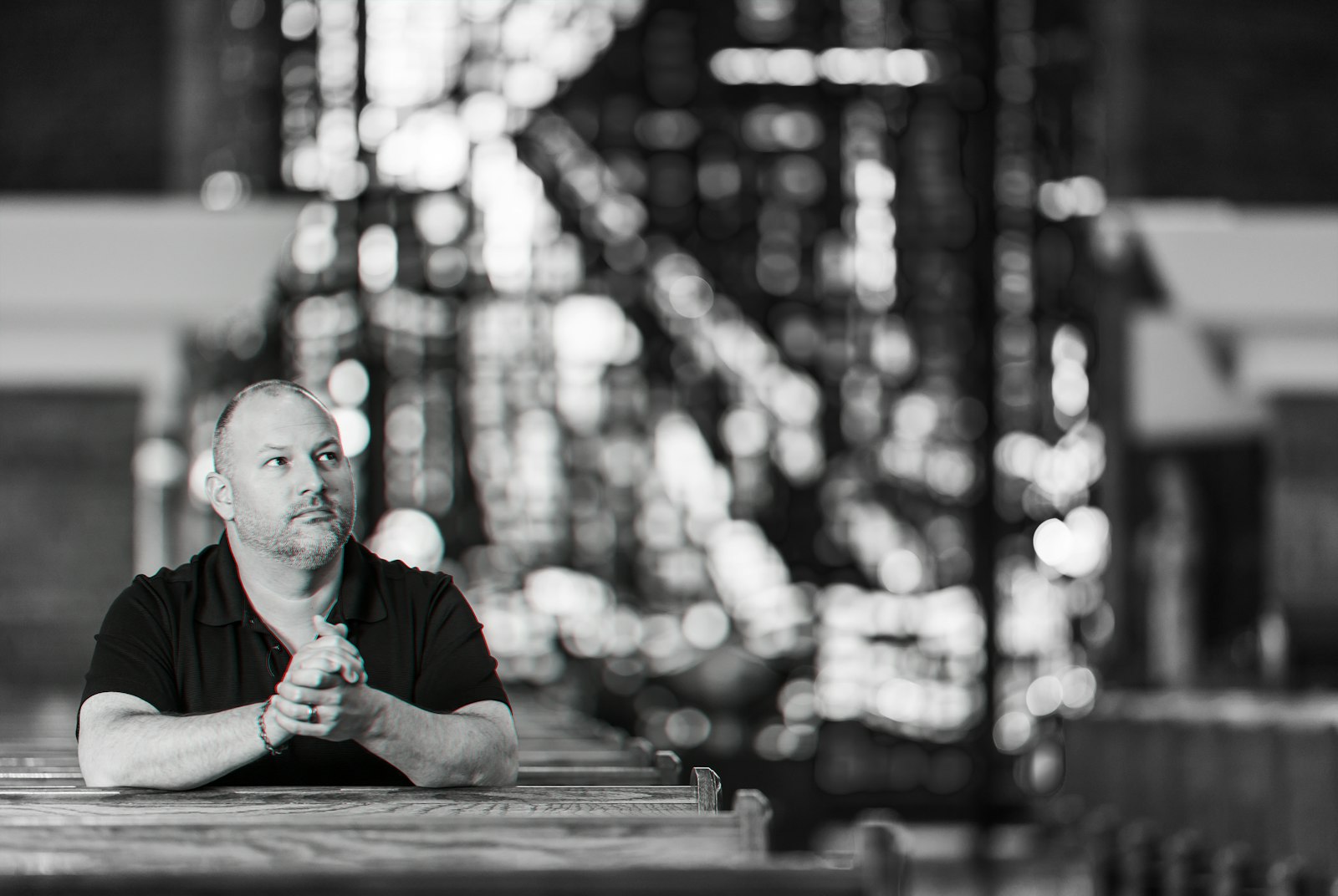 Michael Chamberland, evangelization coordinator at Our Lady of Sorrows Parish in Farmington, prays before the Blessed Sacrament in a photo taken for the I AM HERE campaign. (Valaurian Waller | Detroit Catholic)