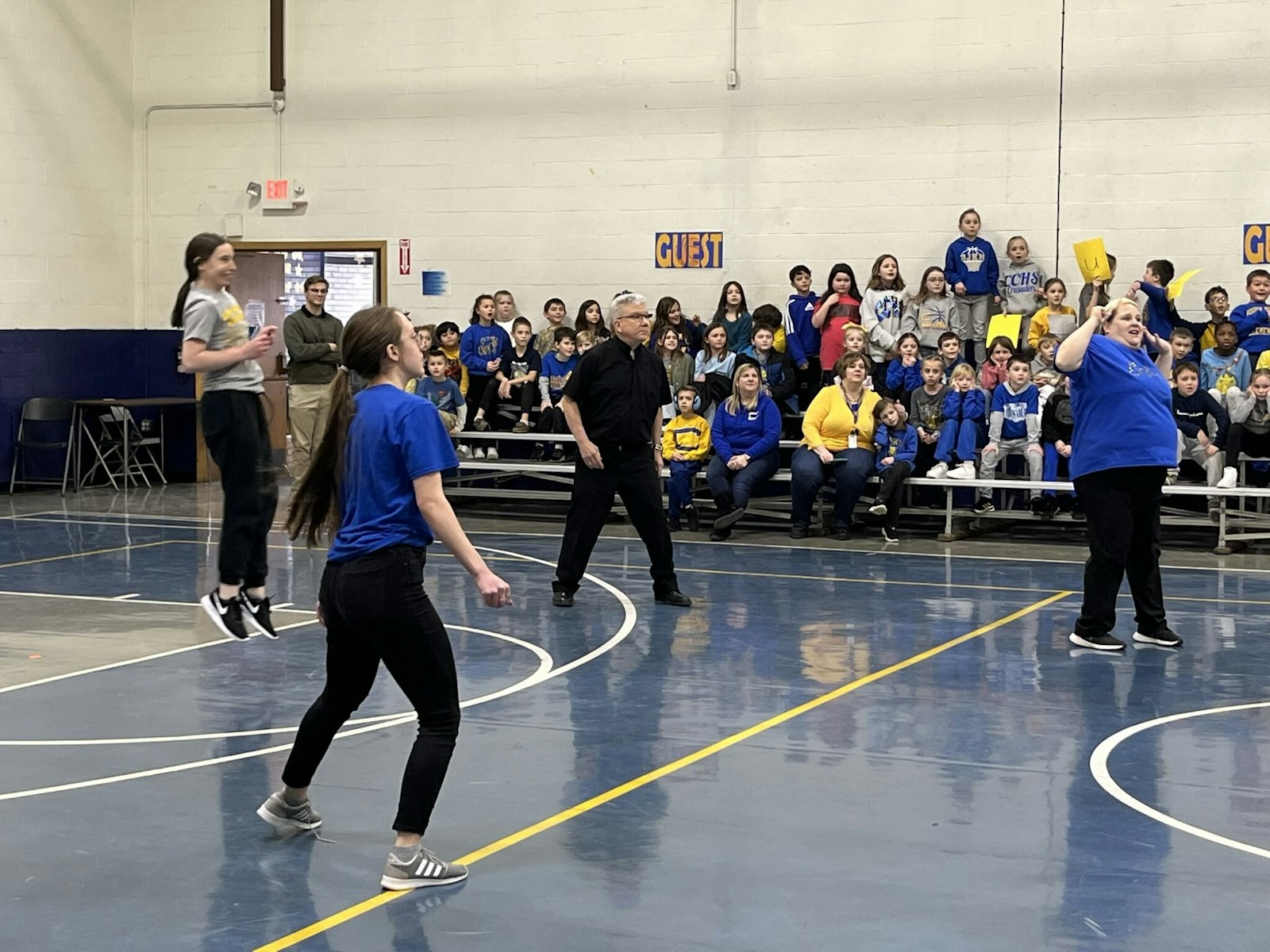Bishop Monforton waits for a serve as he participates in a game of volleyball with students and teachers at Bishop Mussio Grade School and Junior High in Steubenville during Catholic Schools Week earlier this year.