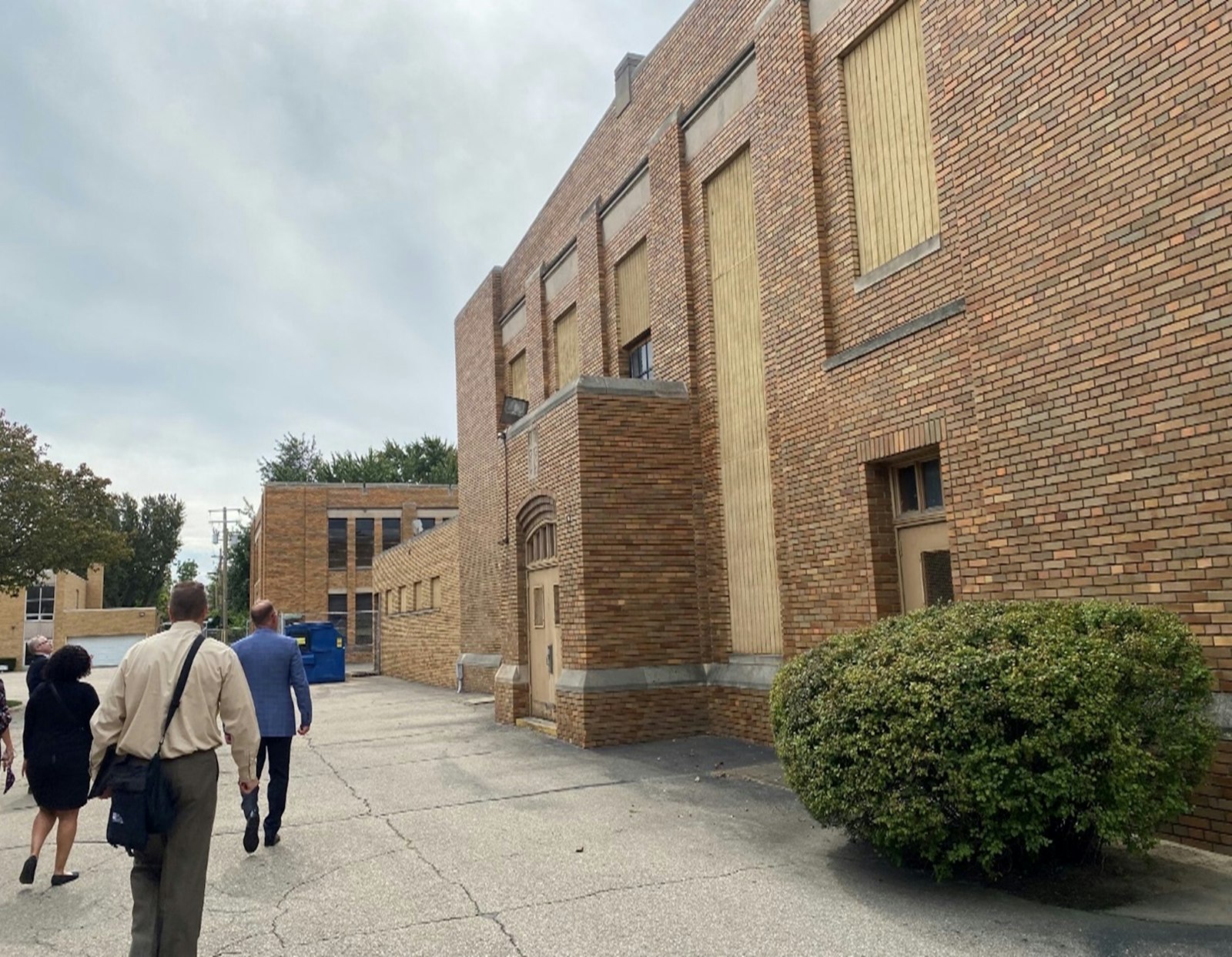 Representatives from Catholic Charities of Southeast Michigan tour the former school building of St. Matthew Parish on Detroit's east side. Plans call for the development of 46 units of mixed-income housing at the former school as part of Catholic Charities' "Healthy Housing" initiative. (Courtesy of St. Matthew Parish)