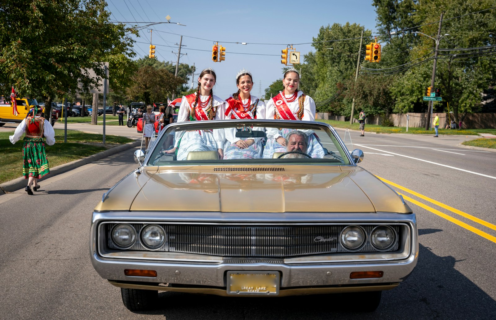 The court of the American Polish Century Heritage Queen rides in the Polish Day parade. Since 1961, the American Polish Century Club has promoted Polish customs and celebrations in the community.