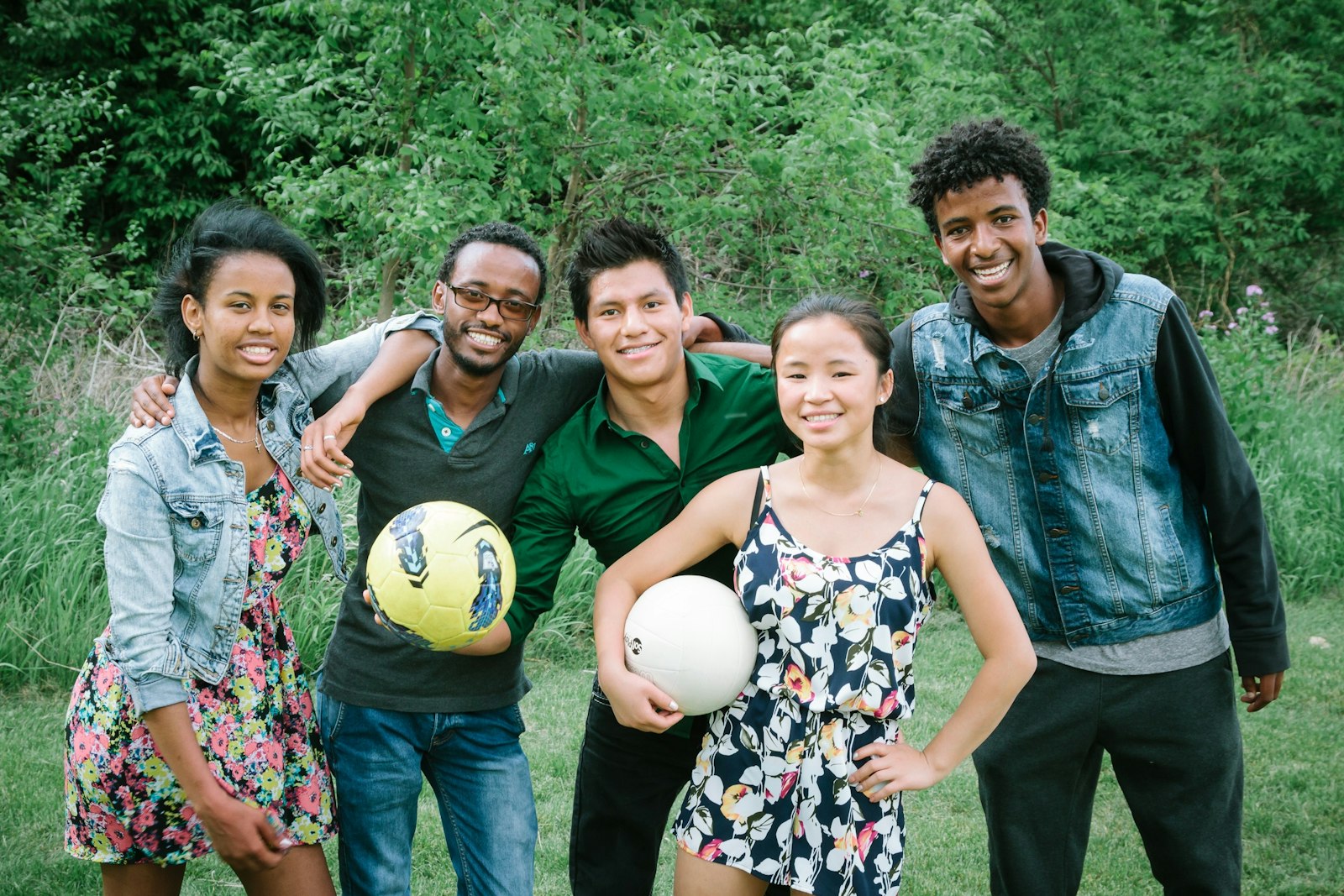 The youth pictured here, who were involved in Samaritas' refugee foster program in Michigan, created a mural in 2015 that sparked the idea for the Samaritas youth art show. The traveling exhibit has been invited to events at churches, community centers, and art galleries.