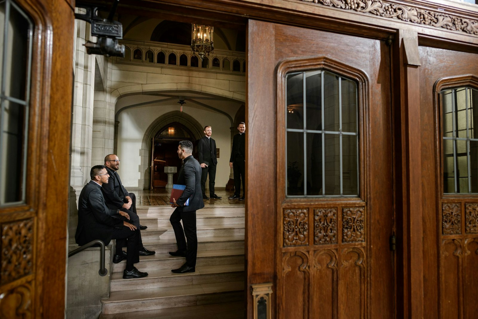 Seminarians chat outside the chapel at Sacred Heart Major Seminary in October 2021. Currently, the Archdiocese of Detroit has 22 men studying for the priesthood, a process that can take six to eight years. Over the past 10 years, the archdiocese has ordained 42 men as priests.