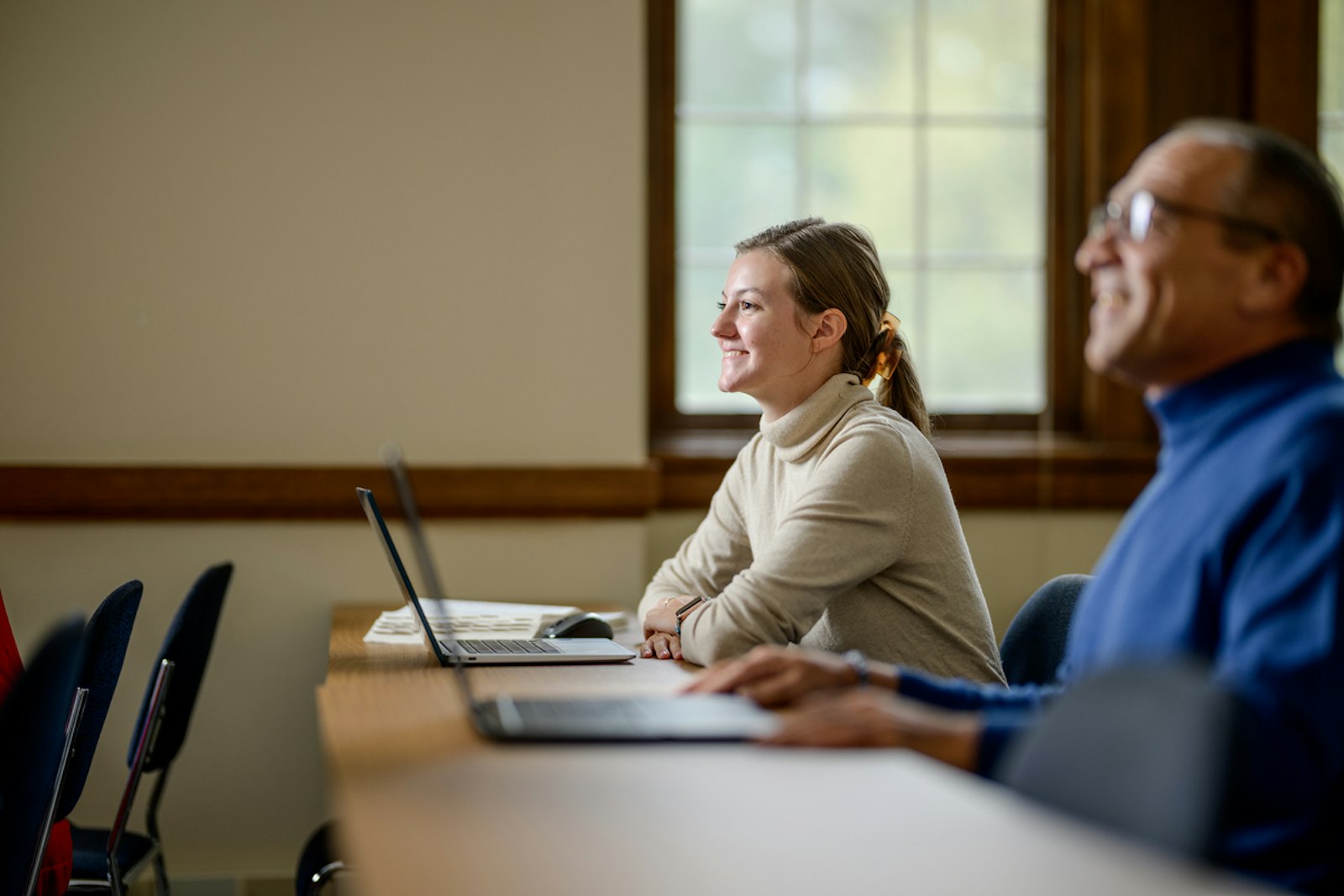 A lay student smiles during a class at Sacred Heart Major Seminary. While the seminary's main campus in Detroit remains a hub for students from all over the archdiocese, Sacred Heart's satellite campuses allow students to learn at their own pace and convenience.