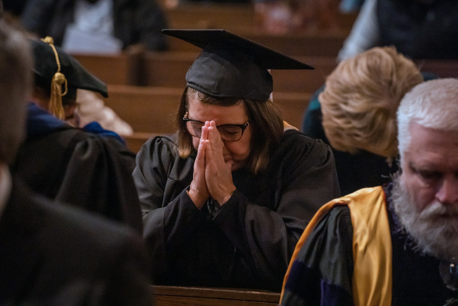Astrid Caicedo, assistant dean of studies and director of accreditation for Sacred Heart Major Seminary, prays during the 98th commencement exercises and baccalaureate Mass April 29 in the seminary's chapel.